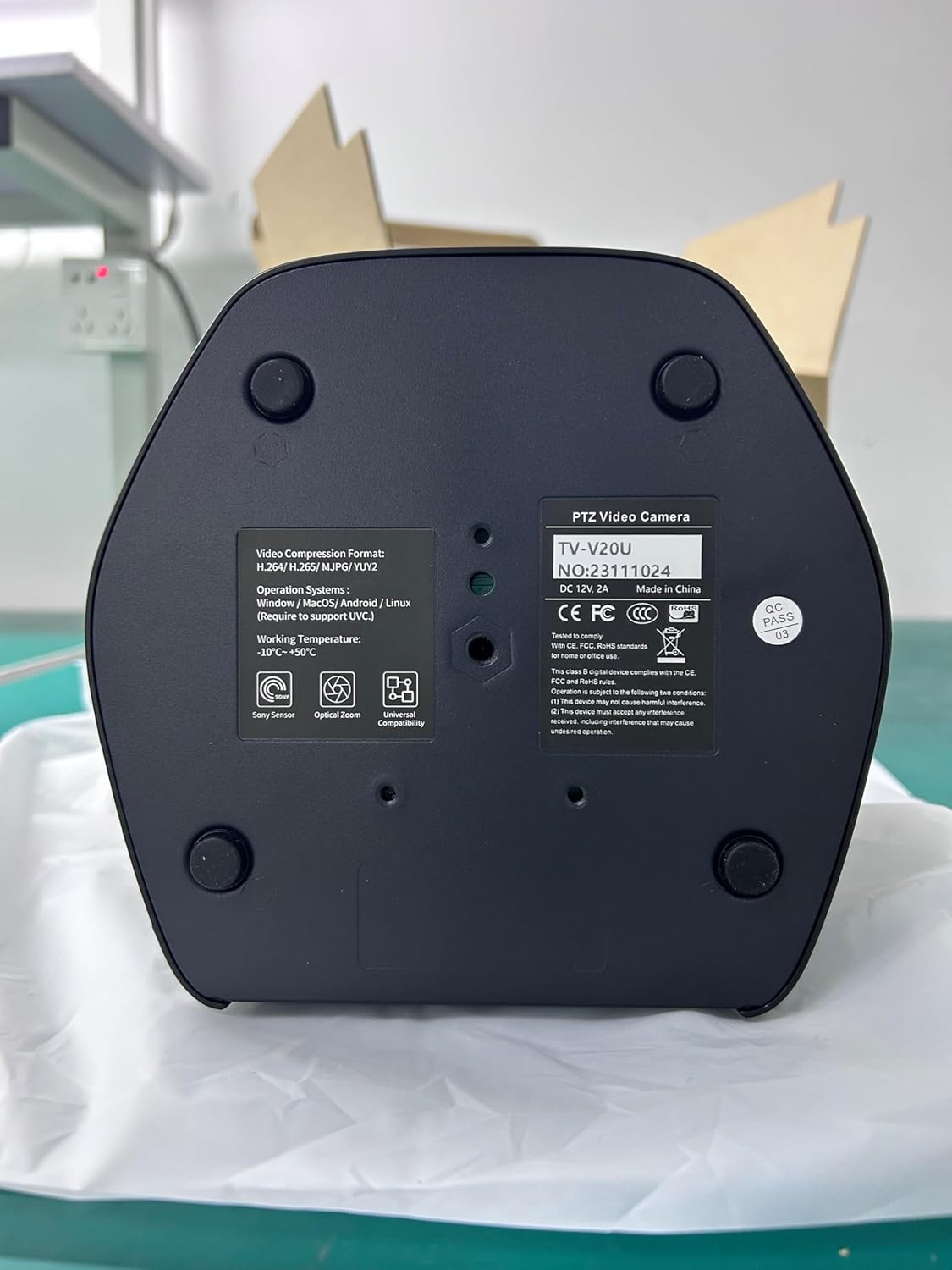 A baix view of the TONGVEO TV-V3U-PRO camera showing model number, serial number, power requirements, and compliance markings.