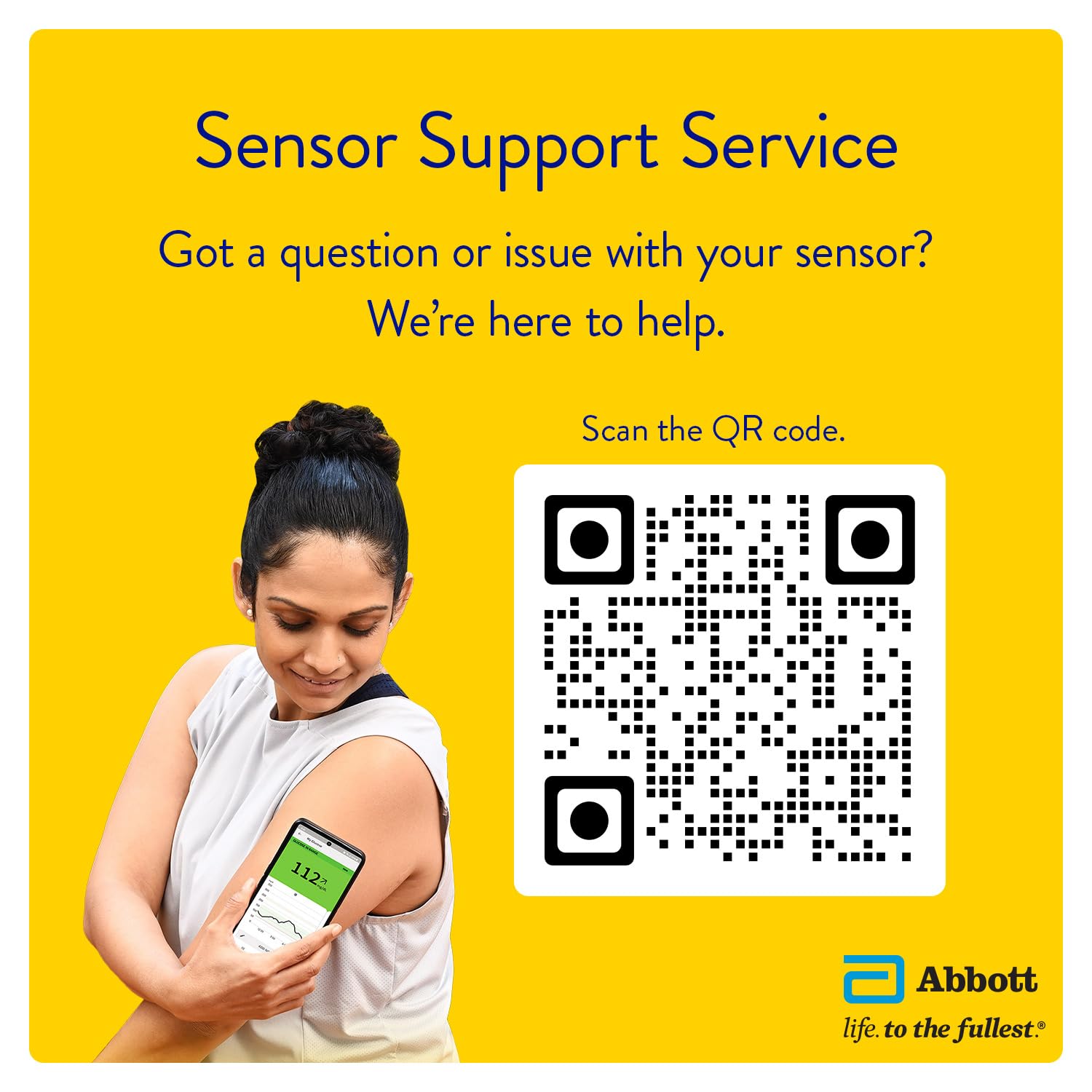 Man scanning his FreeStyle Libre sensor with a smartphone while seated at a dinner table, demonstrating real-time glucose monitoring during meals.