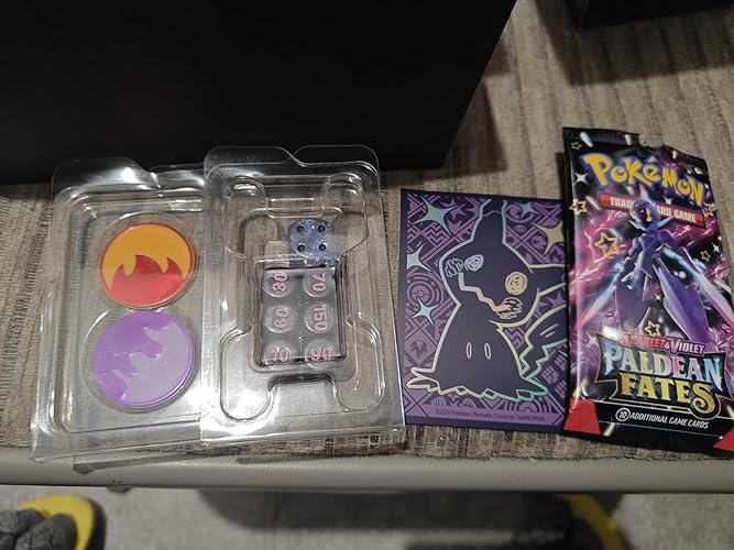 Pokémon TCG: Scarlet & Violet—Paldean Fates Elite Trainer Box (9 boosters,  1 promo card & accessories) : Amazon.com.be: Toys