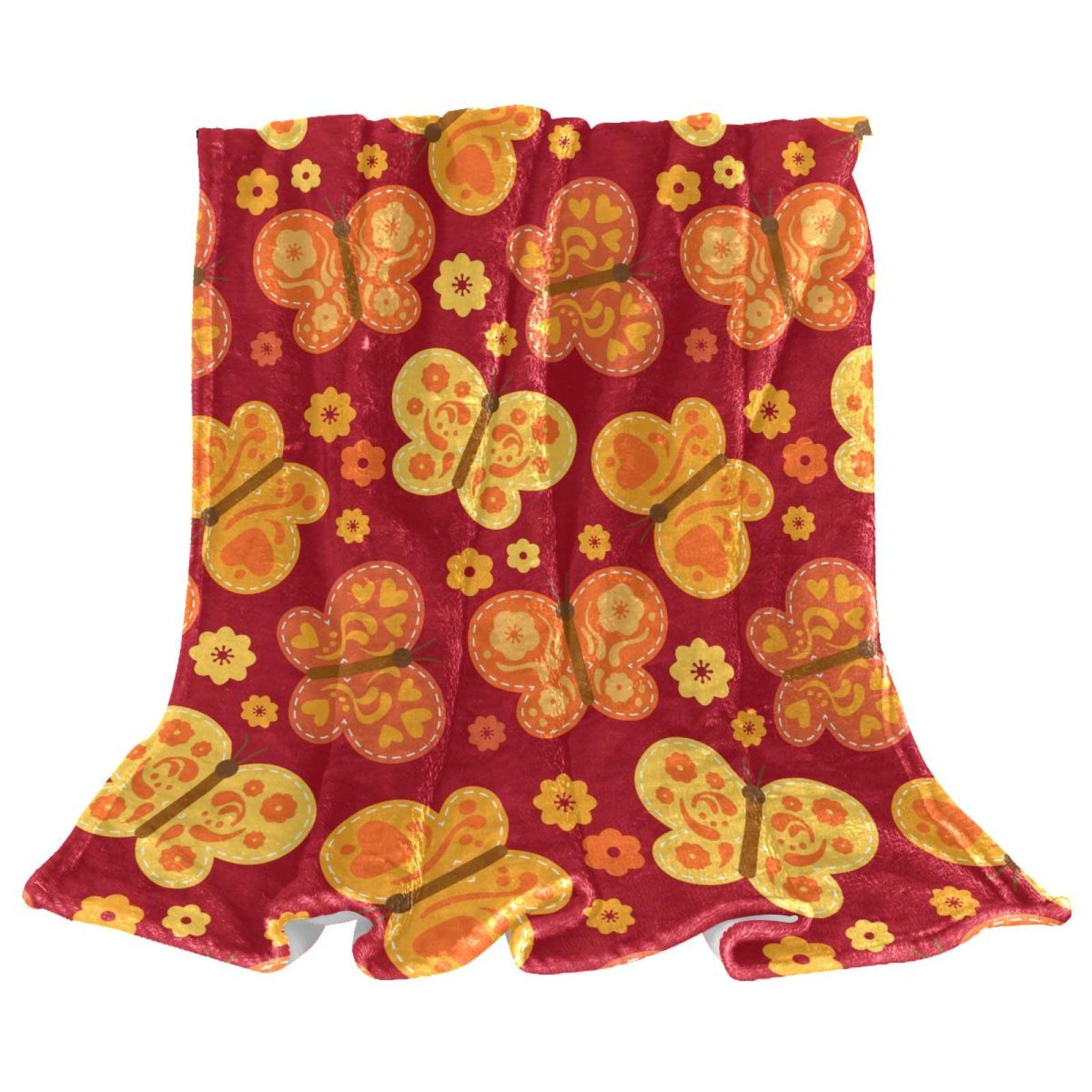 Plaid polaire orange papillon couverture douce pour vos soirées cocooning sur le canapé