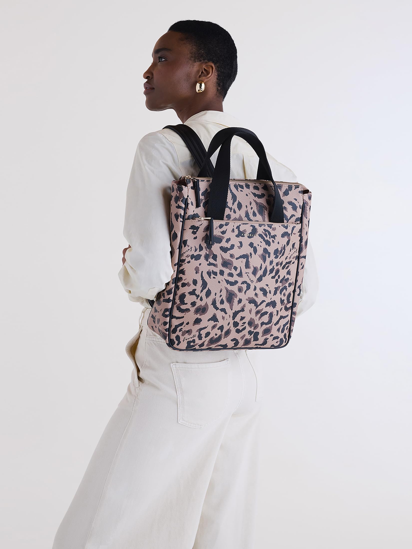 Fiorelli Effie Mochila para mujer, elegante mochila con correas ajustables y compartimento para laptop, piel sintética con estampado Leapard