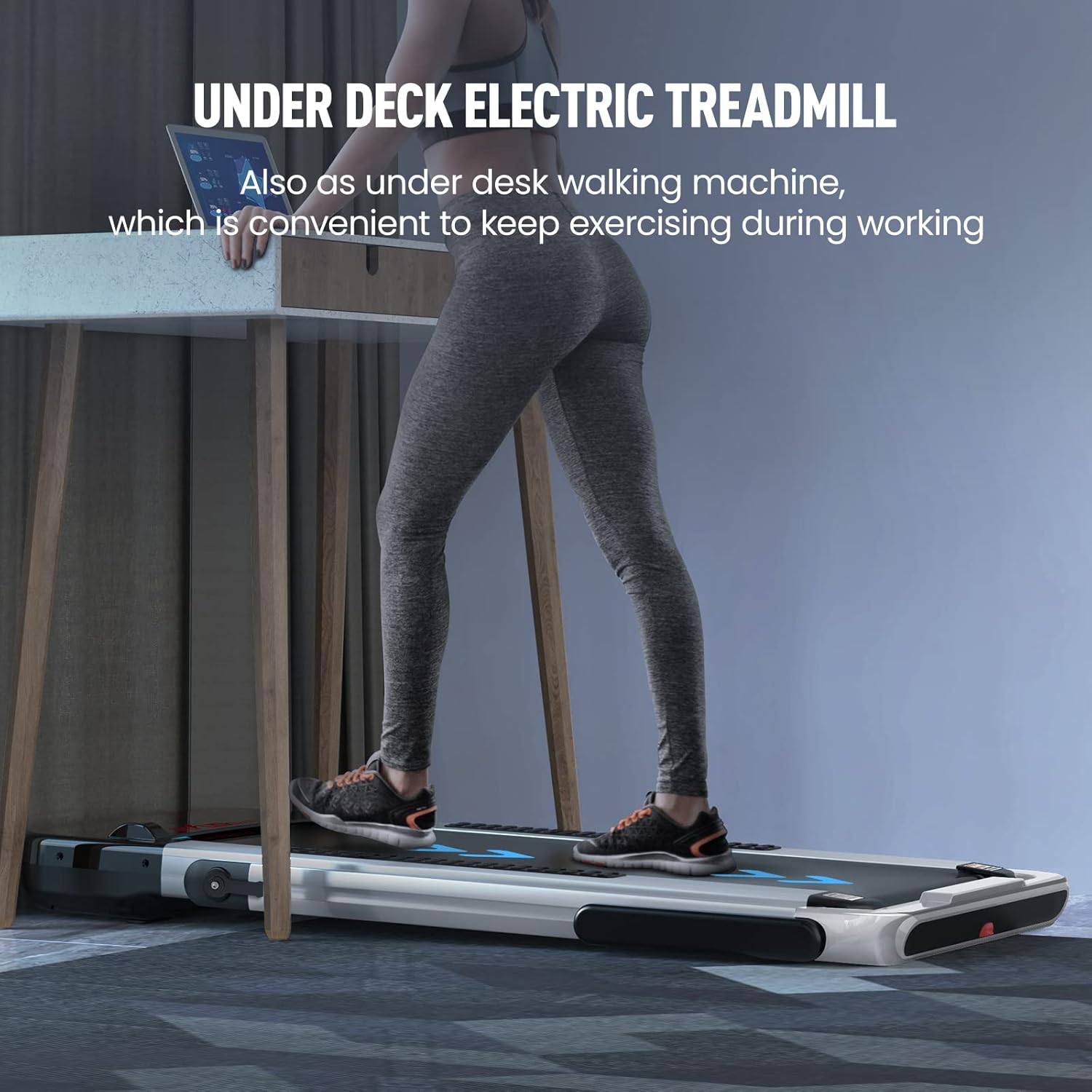 Person using the treadmill in under-desk walking mode with a laptop.