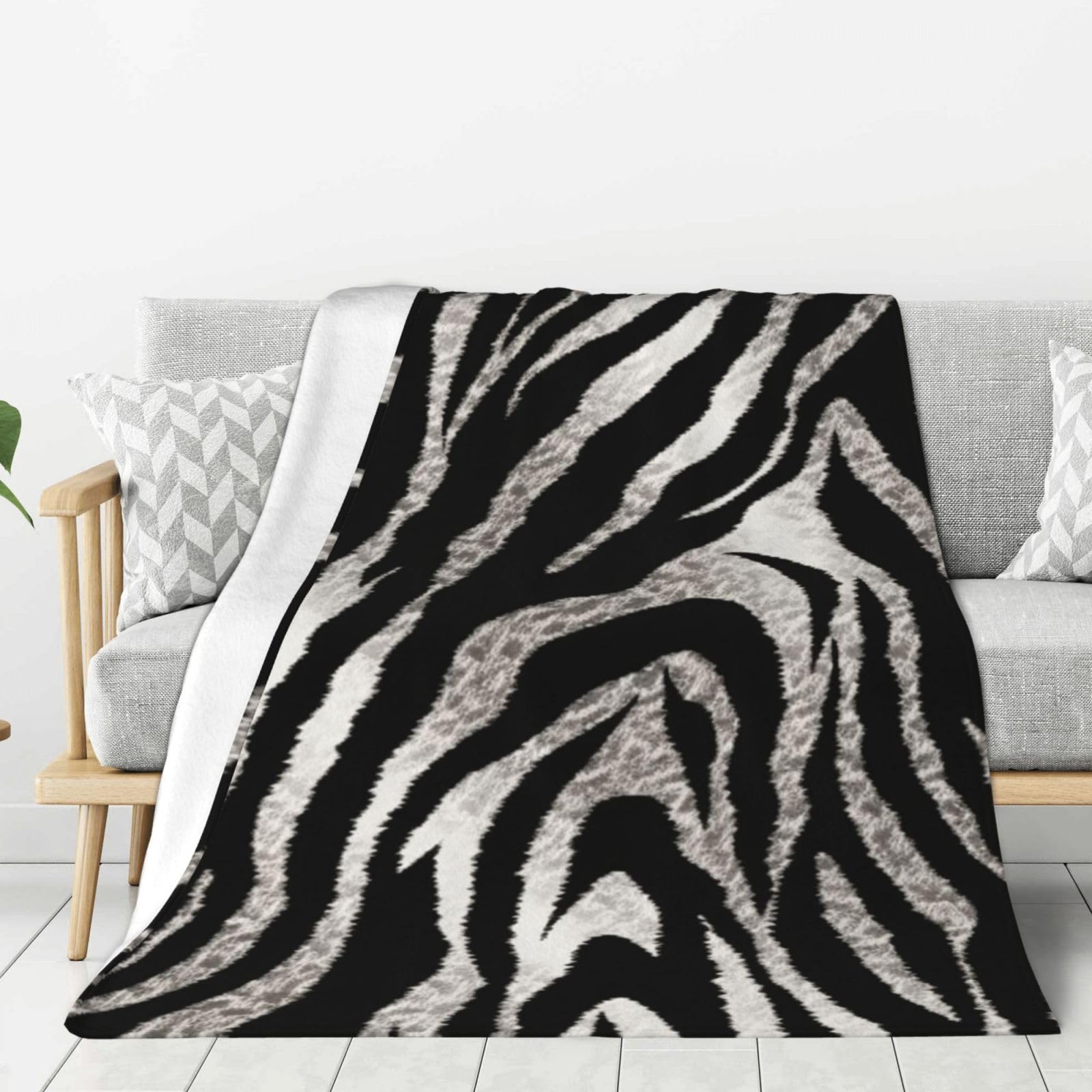 Couverture polaire flanelle zèbre légère pour éliminer le froid sur le canapé