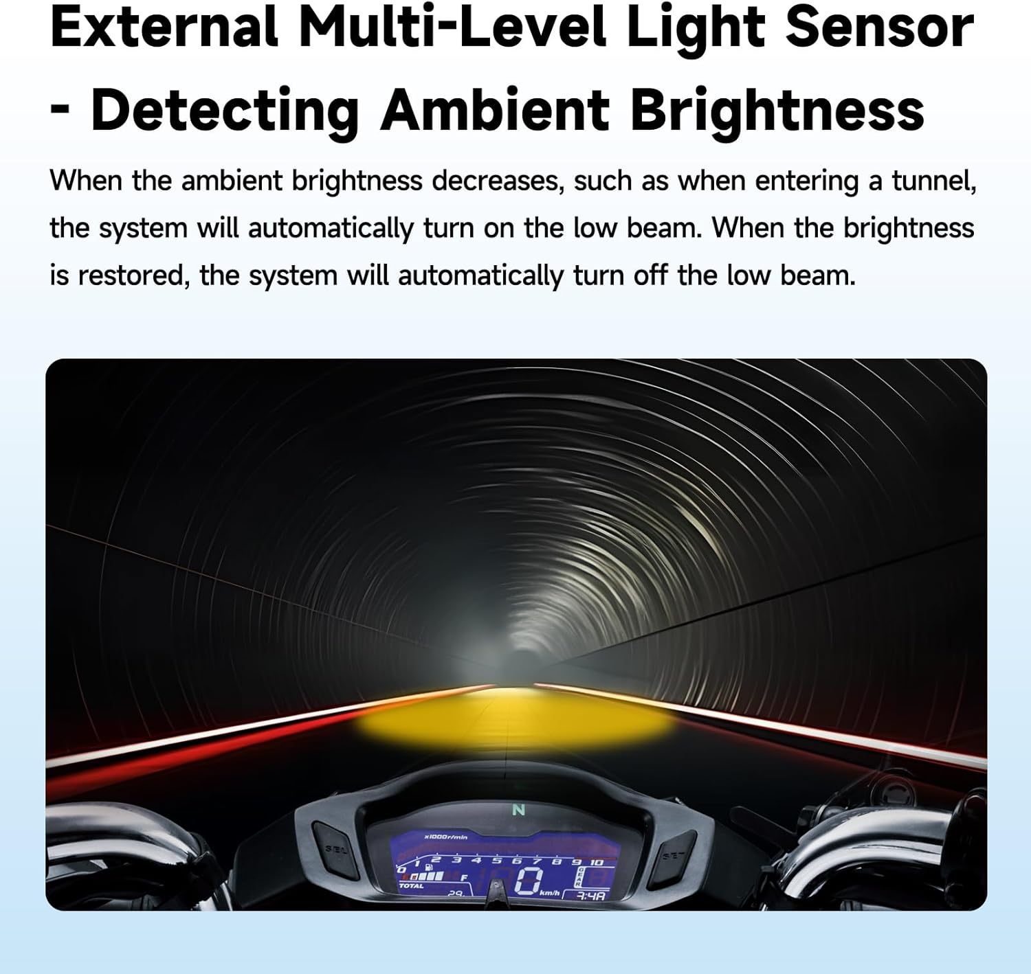 Motorcycle dashboard view inside a tunnel, showing automatic low beam activation