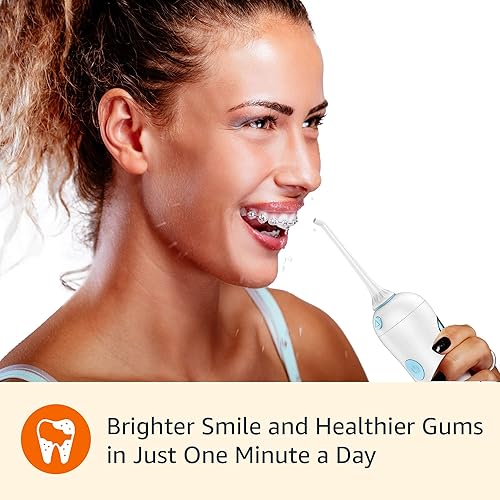 Miniatura 5 de Amazon Basics HydroClean - Irrigador de agua inalámbrico, 1 mango de irrigador de agua, 2 puntas de hilo dental, 2 pilas AA incluidas