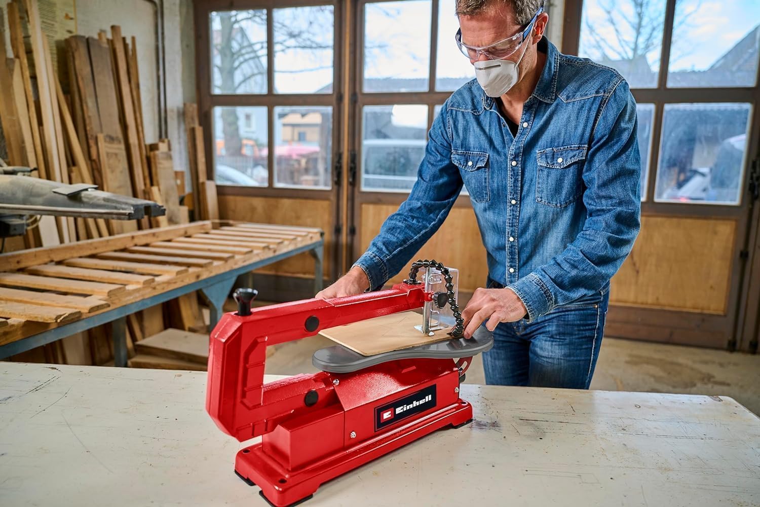 Person operating Einhell scroll saw