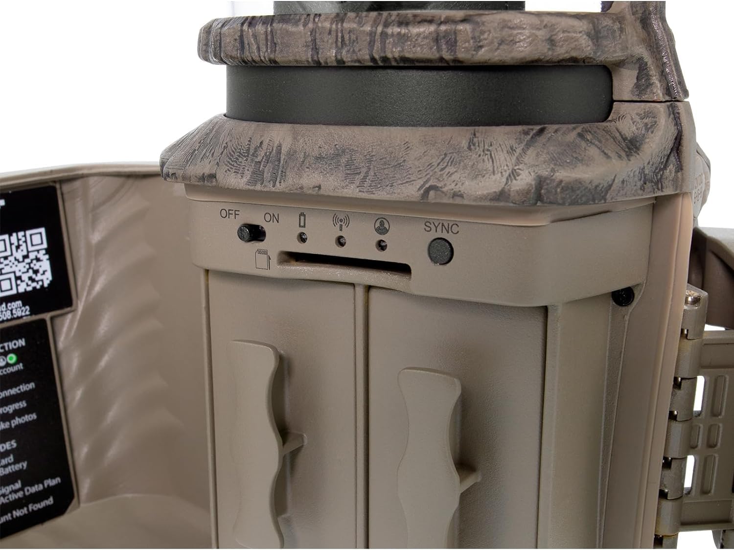 Close-up of Stealth Cam Revolver controls including ON/OFF switch, SD card slot, and SYNC button