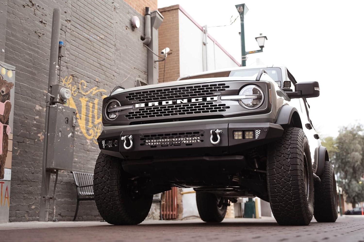 DV8 Offroad OE Plus Series Front Bumper Compatible with 2021-2026 Ford Bronco | Multiple Light Mounts | Compatible with OEM Skid Plate, 360° Camera, & Sensors | Reinforced D-Ring Mounts