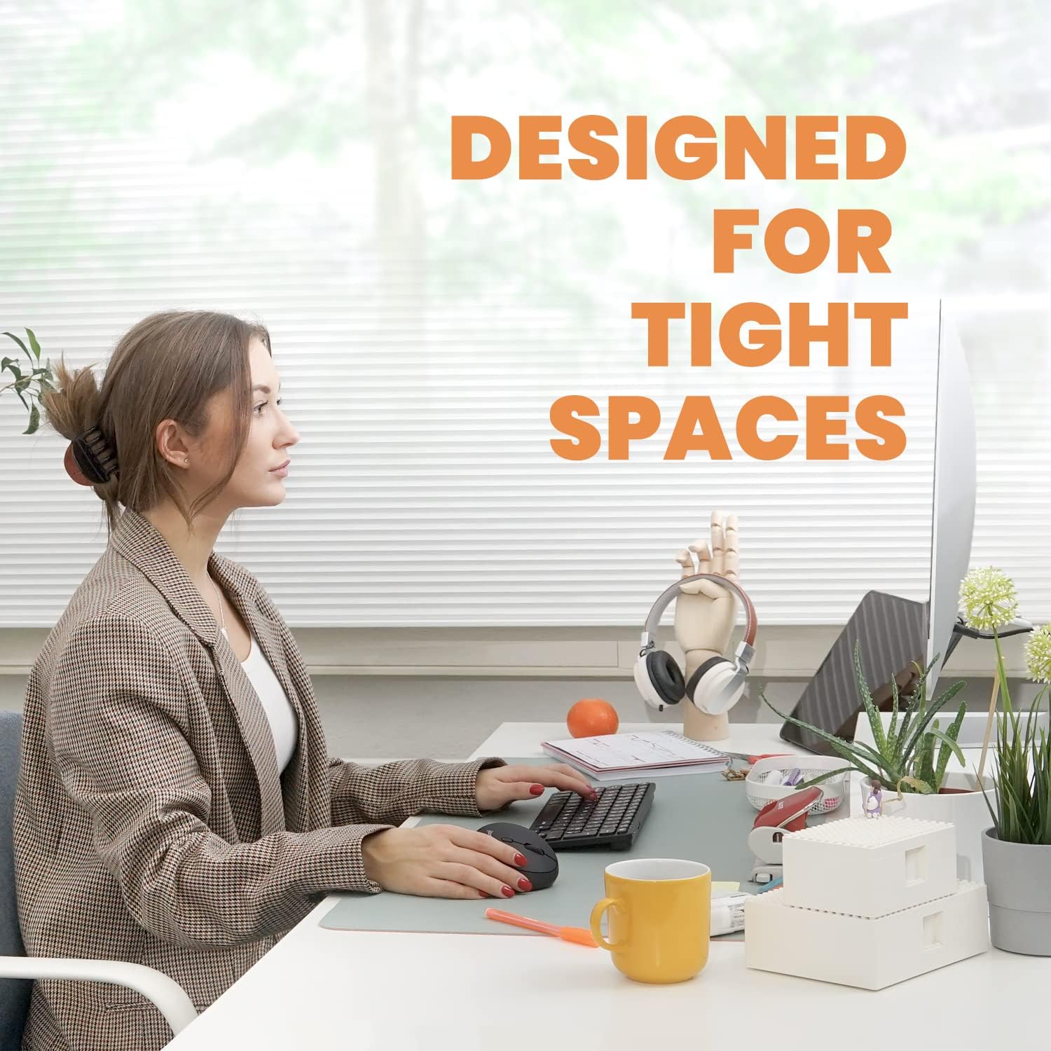 Perixx PERIBOARD-732B keyboard on a desk, illustrating its compact size and suitability for tight spaces.