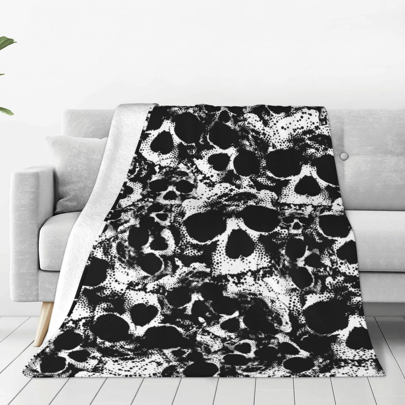 Couverture tête de mort noire en microfibre douce pour vos soirées cocooning au salon