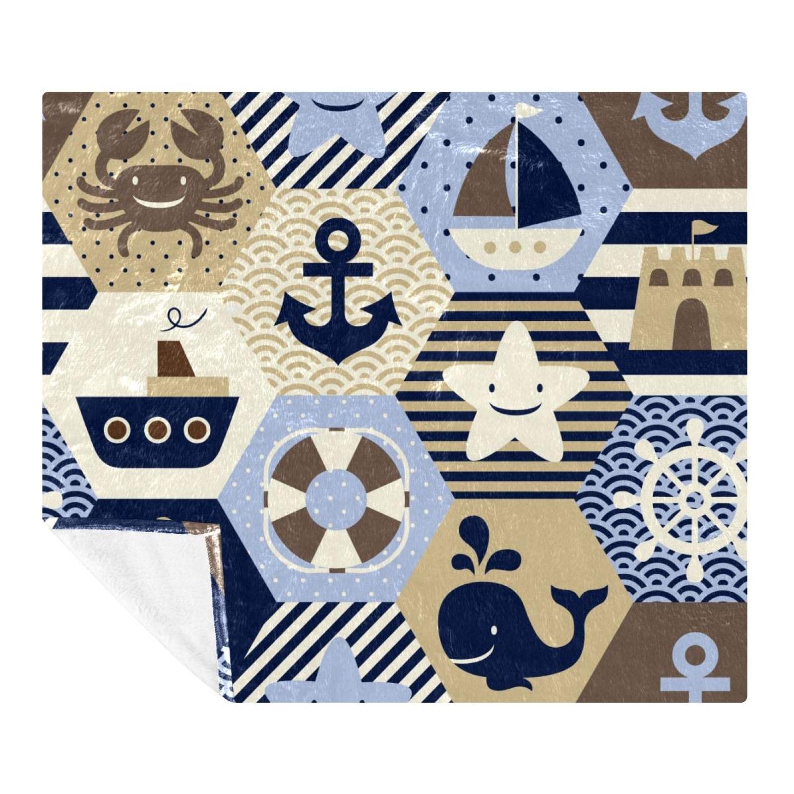 Couverture motif ancre et baleine pour des moments cocooning sur le canapé