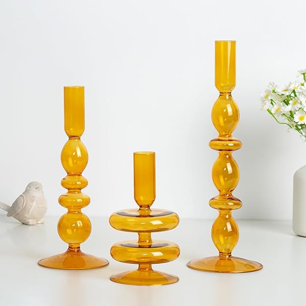 Set of three light amber glass taper candle holders