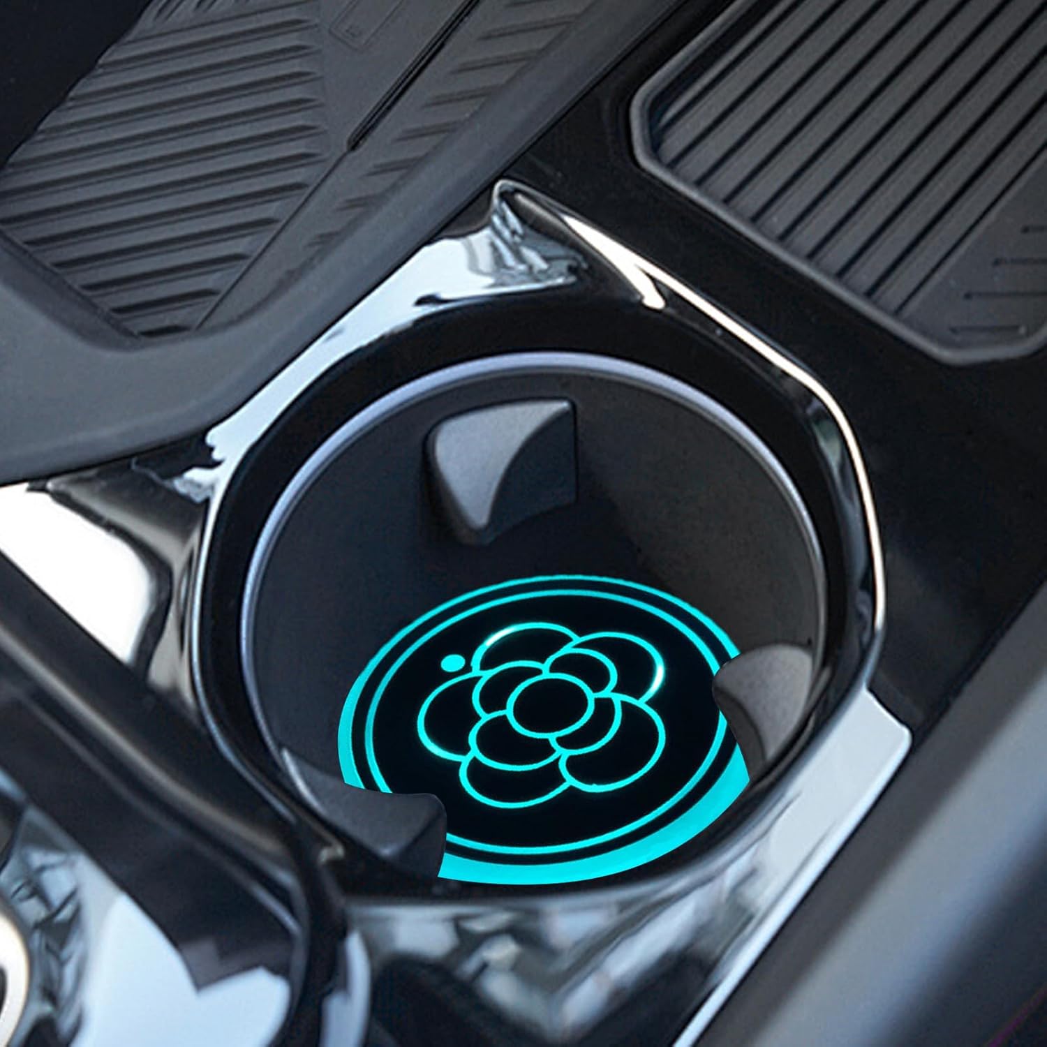 LED cup holder light placed in a car cup holder, glowing blue