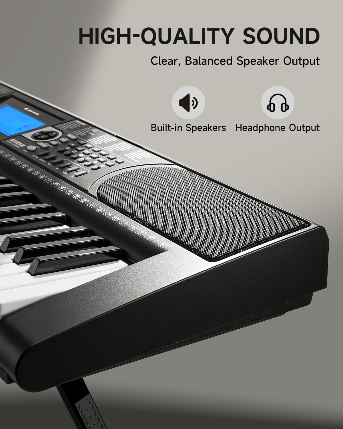 Close-up of Donner DEK-630 speaker and headphone output