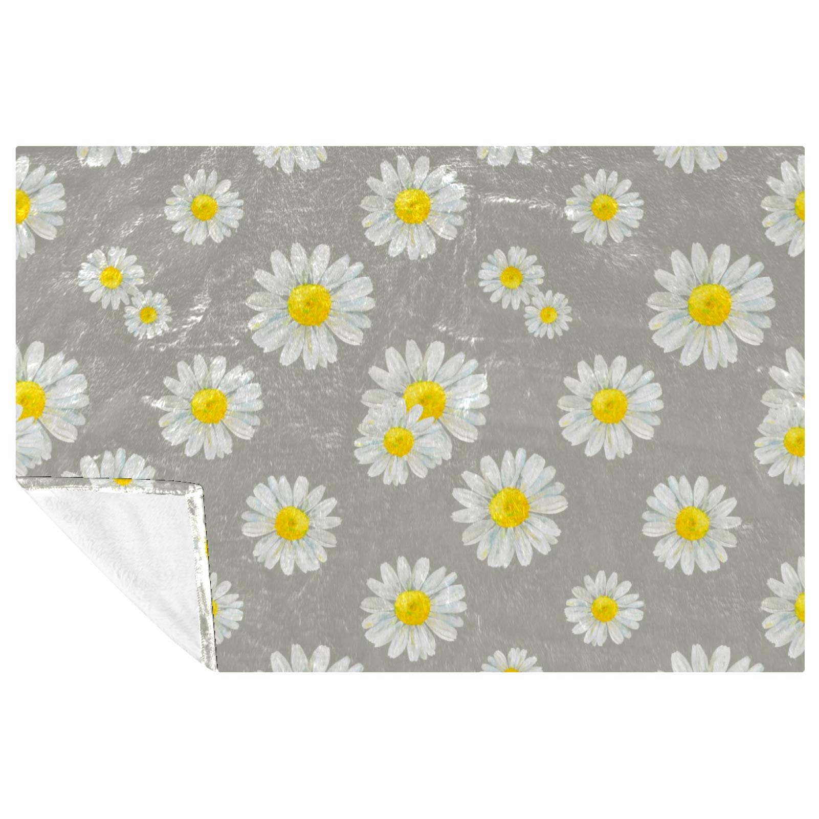 Couverture camomille chaude contre le froid sur le canapé