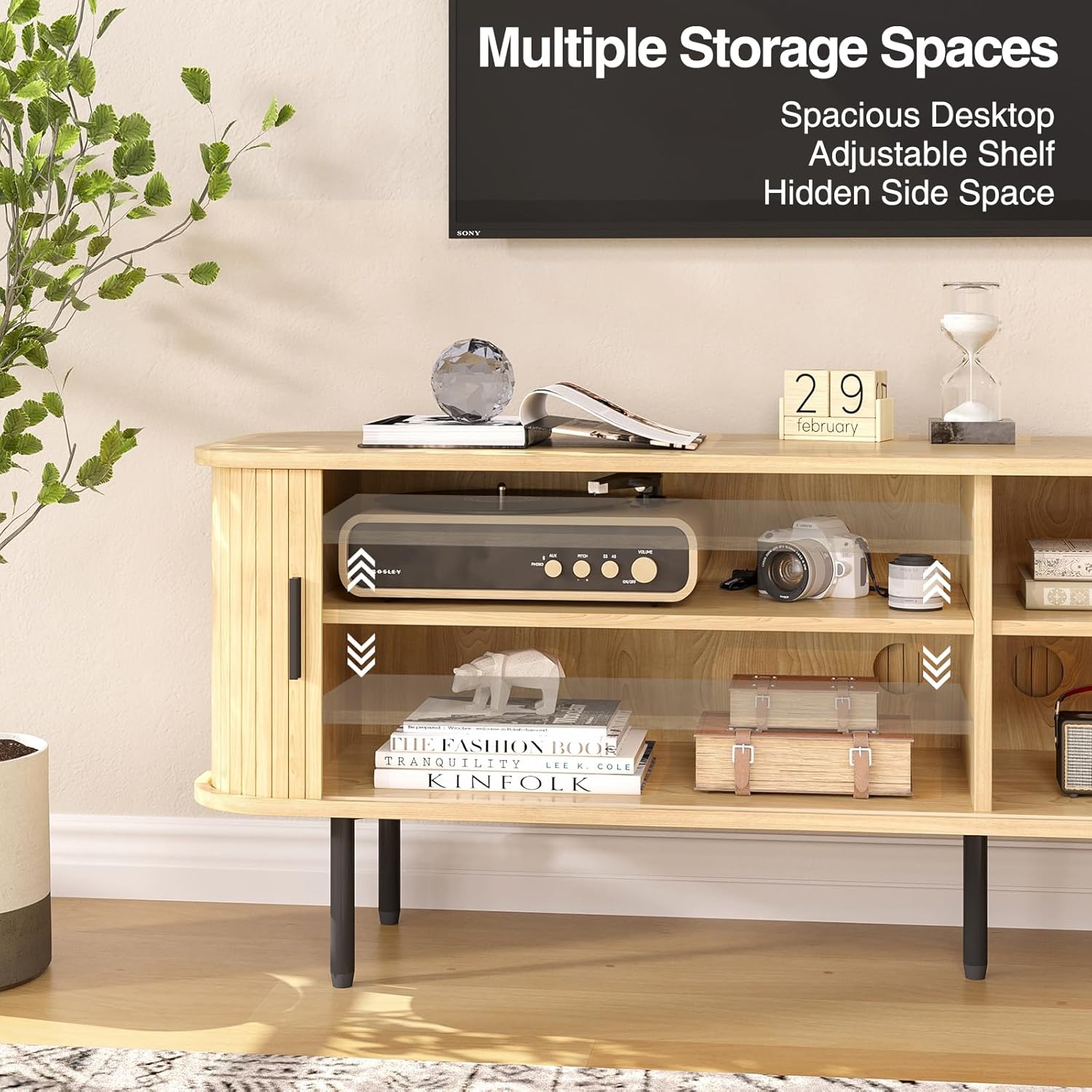 Interior view of the TV stand showing multiple storage compartments, including adjustable shelves.