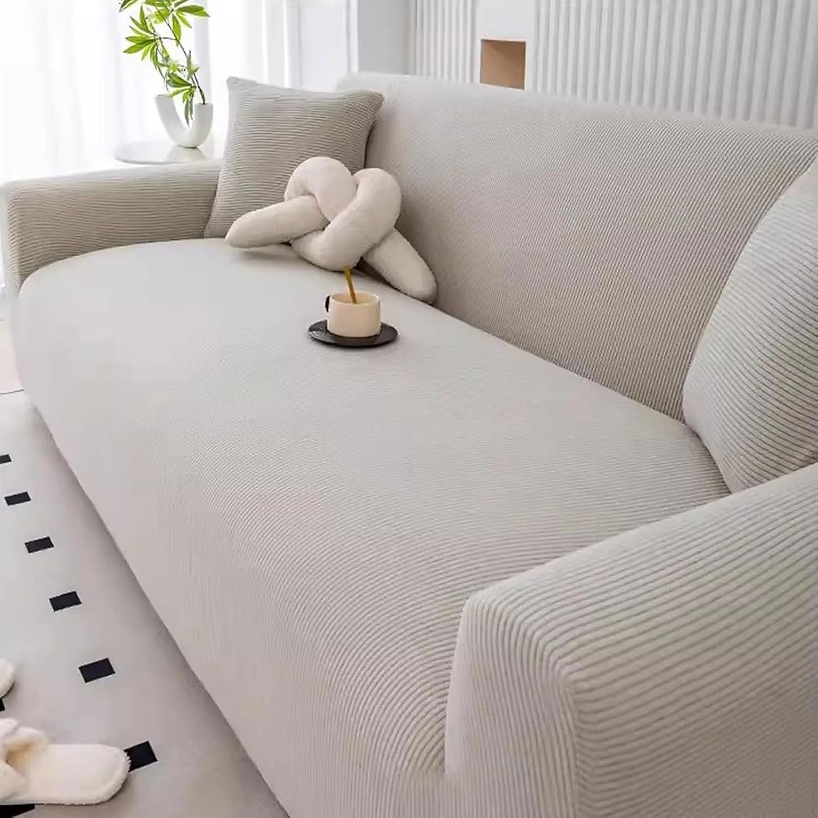 Housse de canapé extensible jacquard gris et protection antidérapante