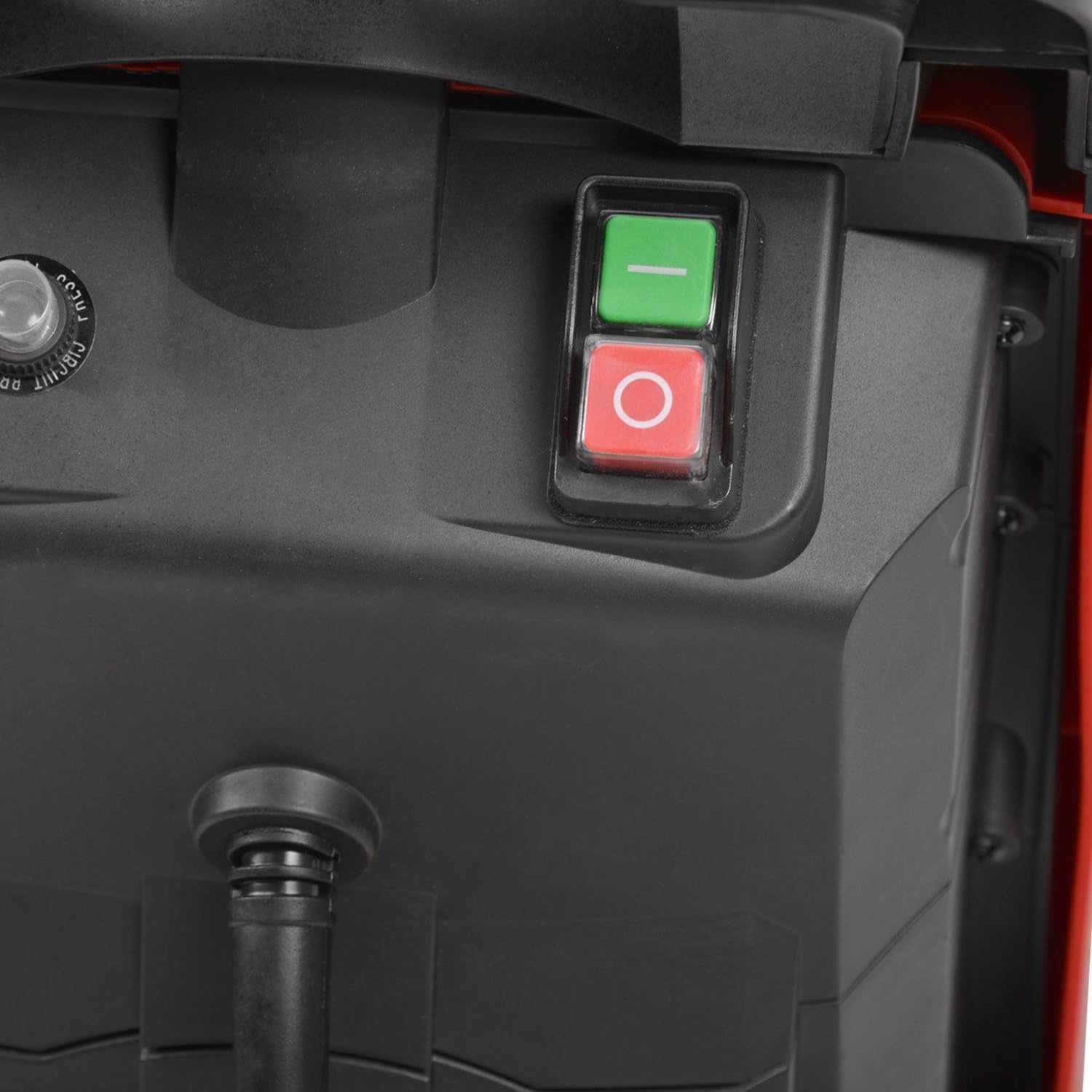 Close-up of the shredder's green start button and red stop button