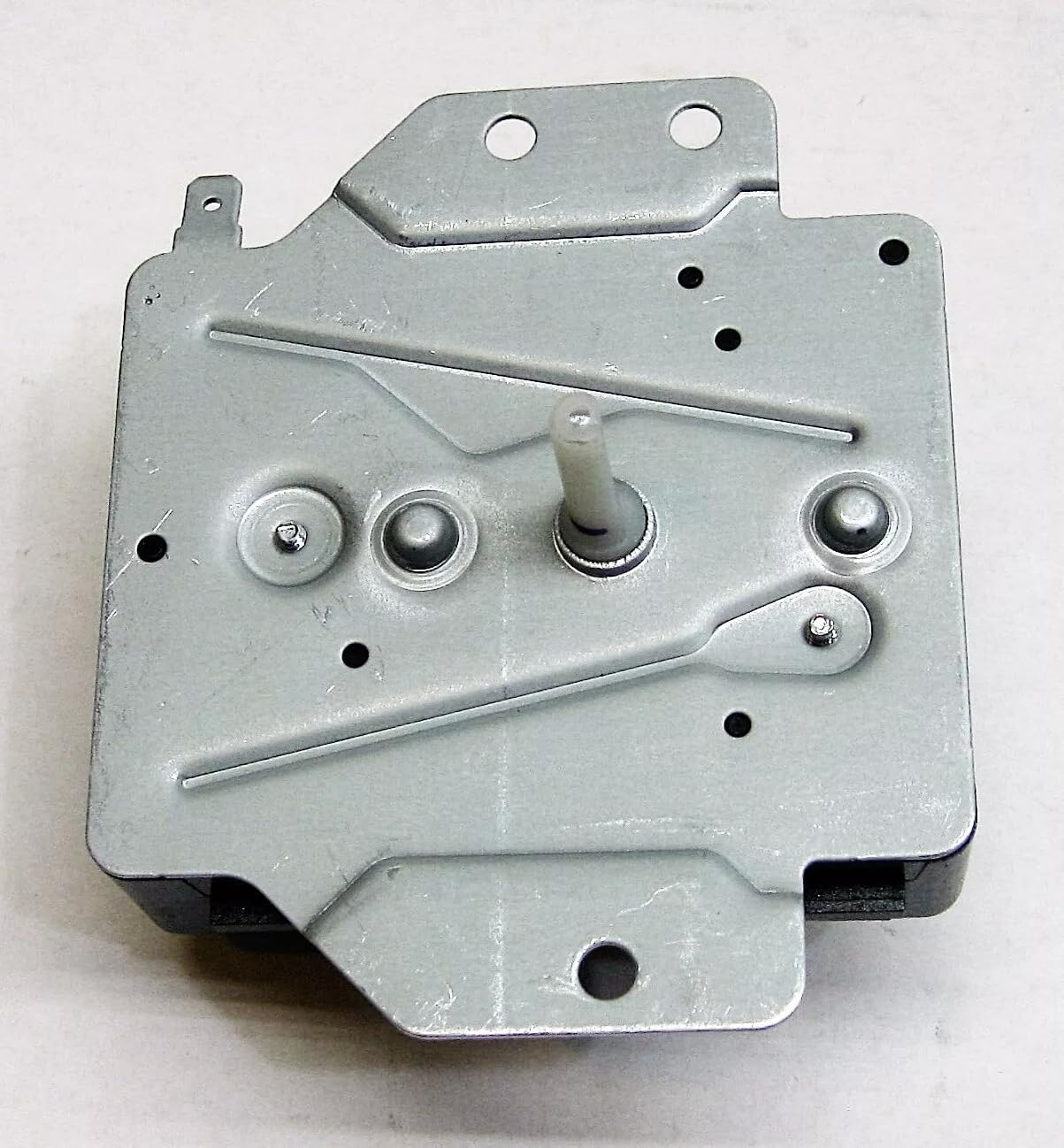Top view of the Dryer Timer Control's metal mounting plate and central shaft.