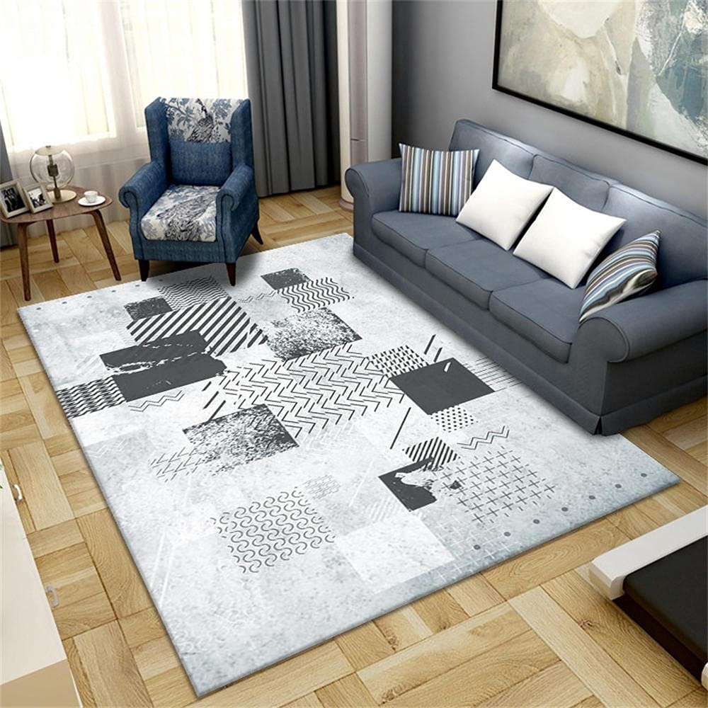 Grand tapis de salon au graphisme minimaliste et moderne avec des formes géométriques