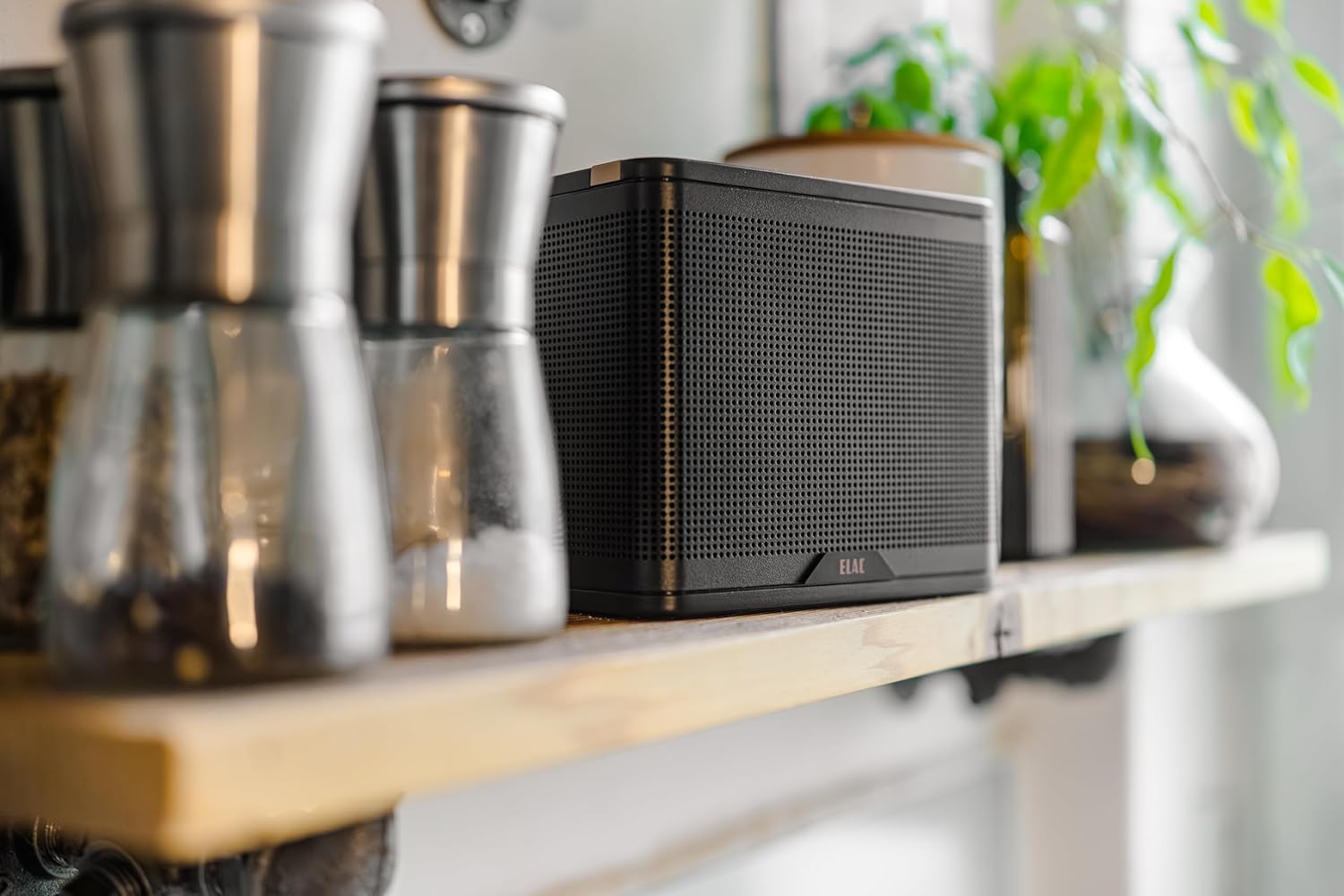 Pada view of the ELAC NAVA100 Portable Bluetooth Speaker, showing the USB-C charging port.