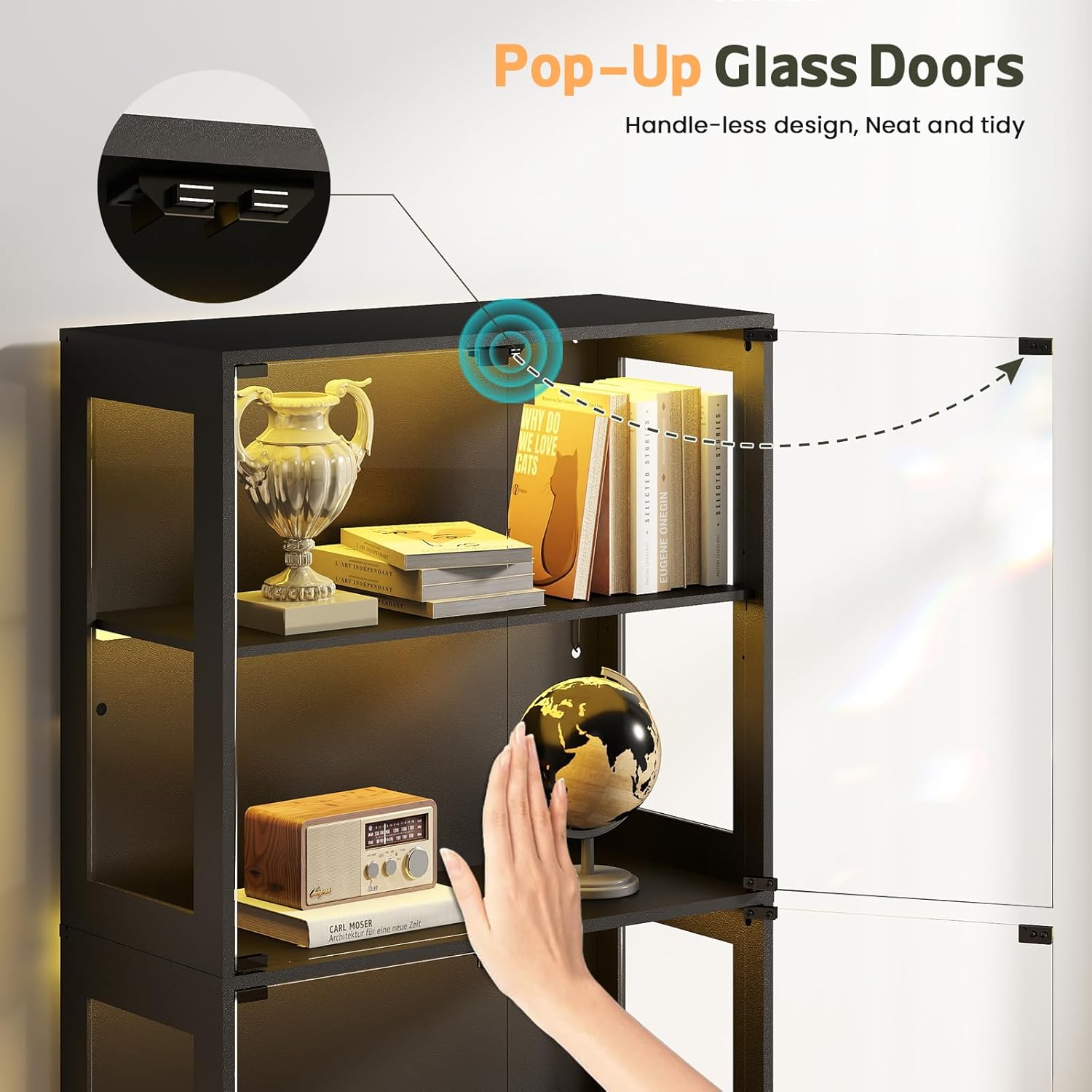 Hand demonstrating the press-and-pop mechanism of the glass door