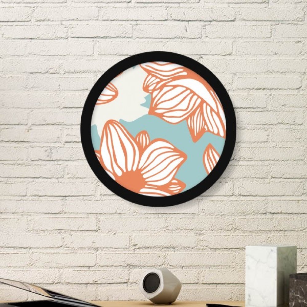 Peinture fleur orange bleu dans son cadre rond en bois noir pour un salon accueillant