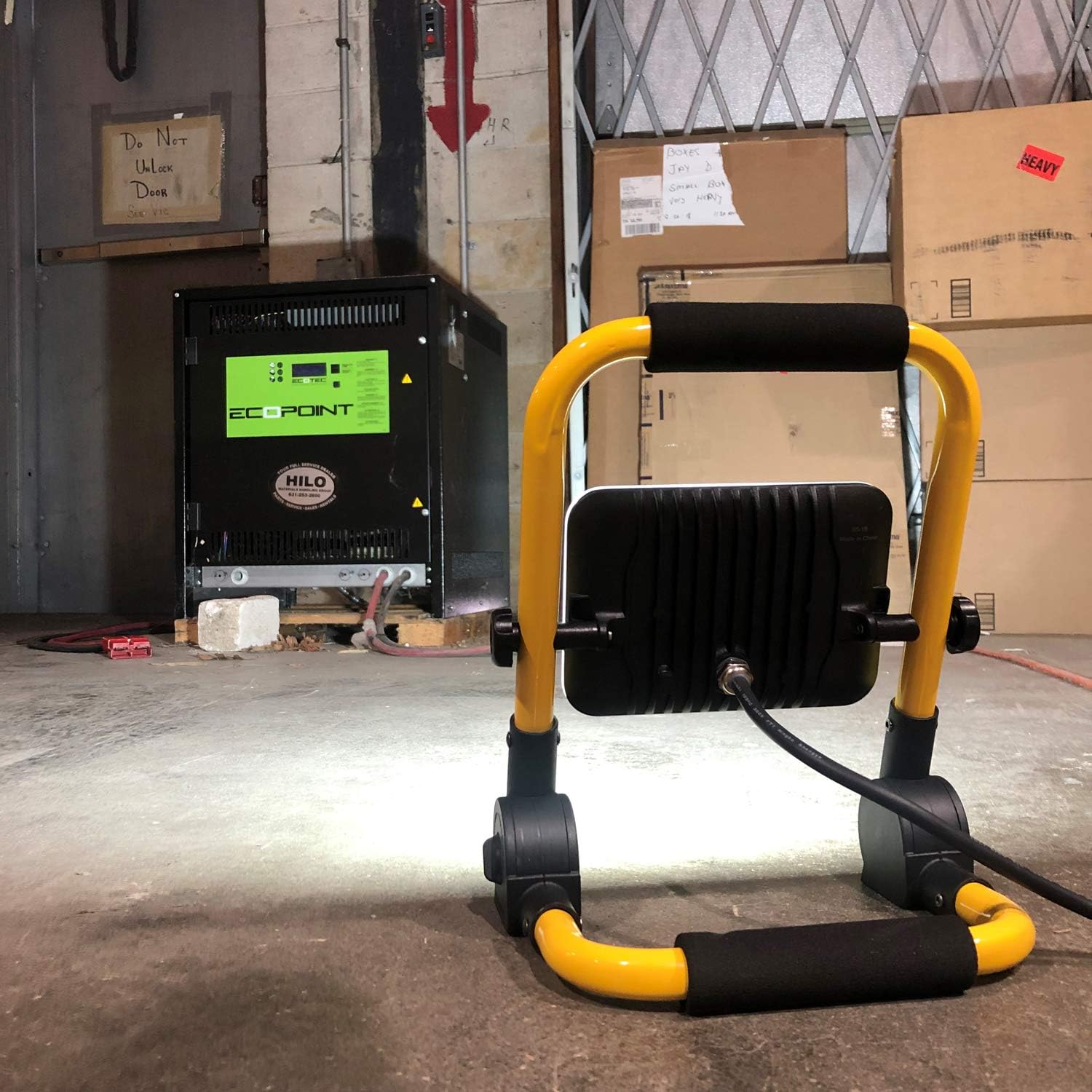 Maxxima Portable LED Work Light illuminating a dark room