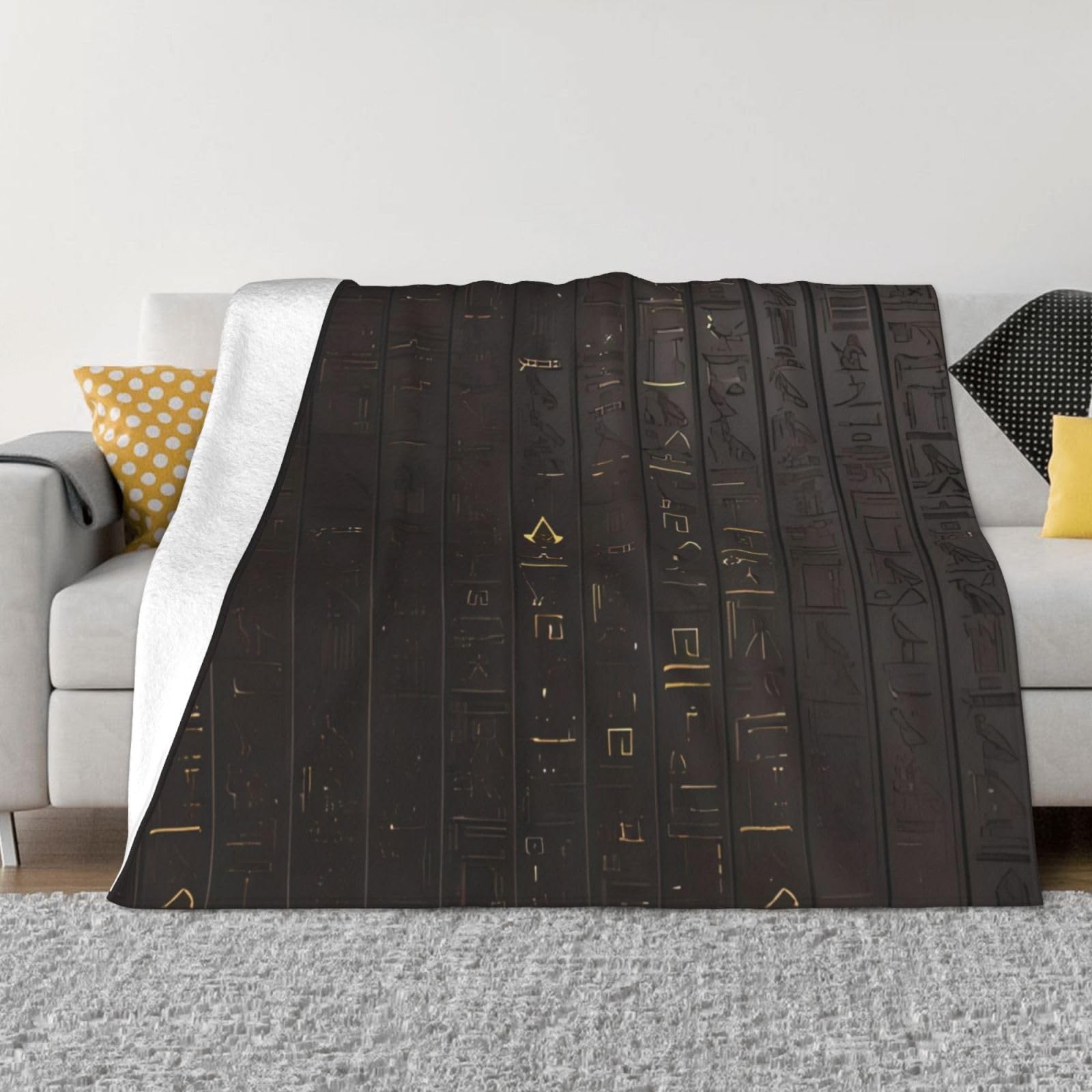 Couverture en polaire douce et son design égyptien pour créer un nid douillet à la maison