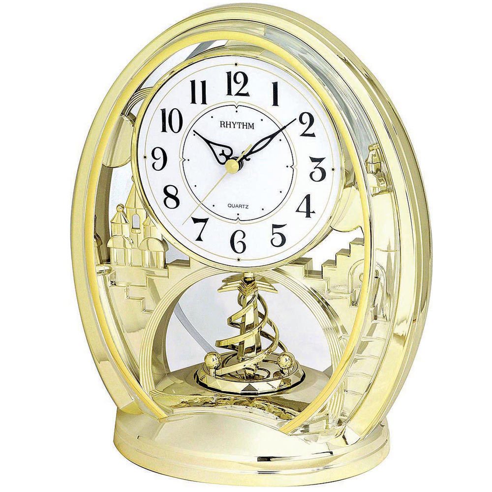 Rhythm Gold Oval Mantel Clock Rotating Spiral Pendulum 4SG768WR18