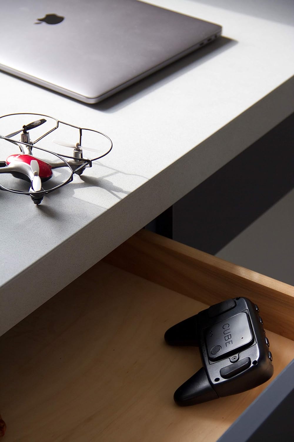 CUBE Shadow in a drawer with other items
