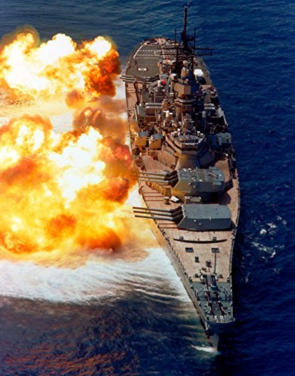 Battleship USS Iowa firing its Mark 7 16-inch50-caliber guns Poster Print by Stocktrek Images (11 x 17)