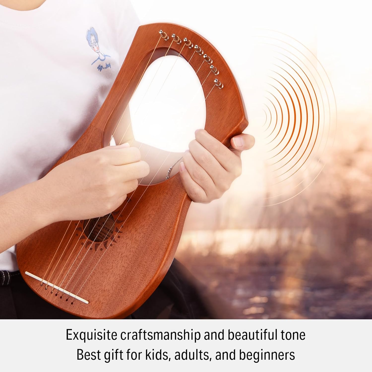Person tuning Donner Lyre Harp with wrench