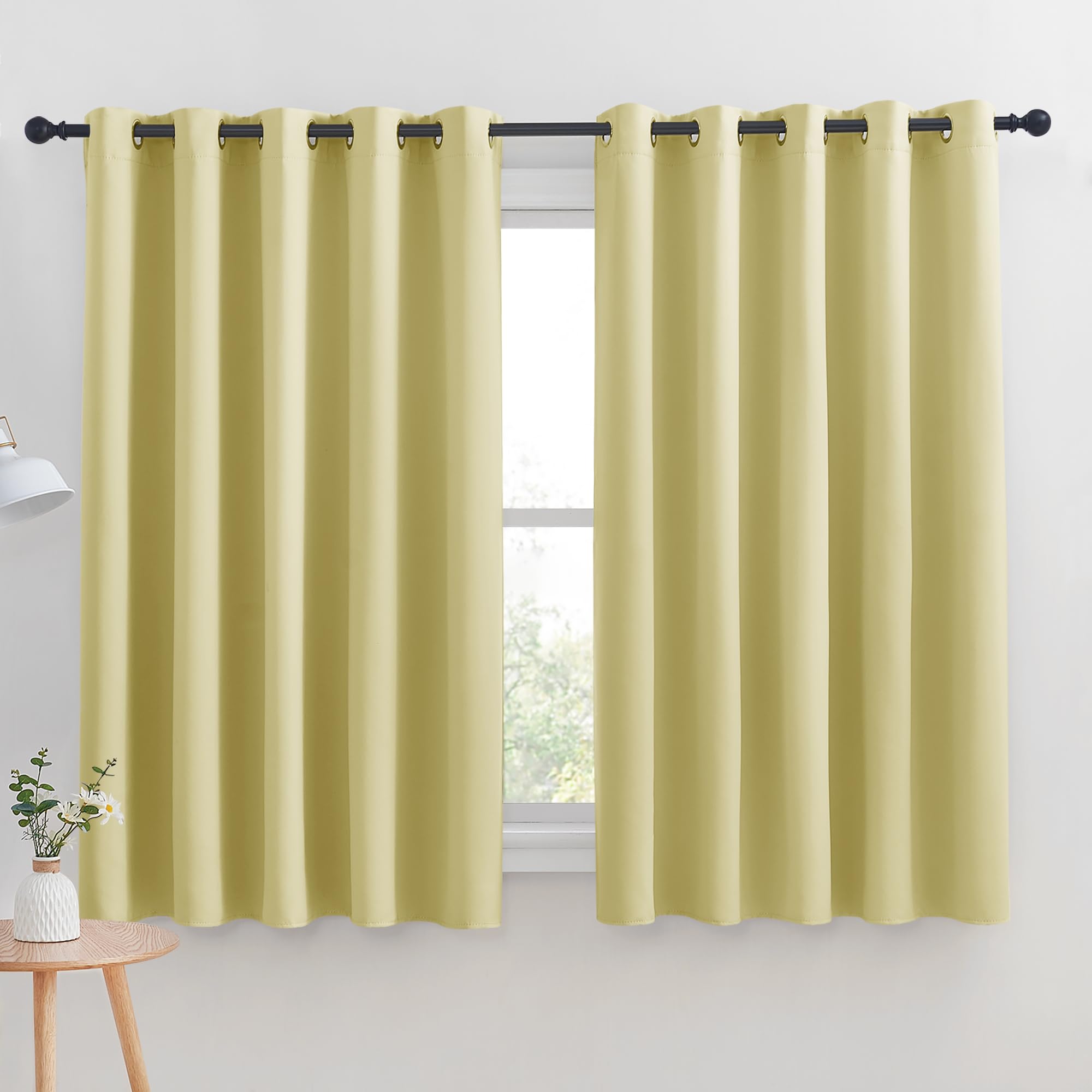 NICETOWN Thermal Insulated Paler Yellow Blackout Curtains for Bedroom, Set of 2, 70 by 63 inches Long, Window Treatment Solid Grommet Room Darkening Drape Panels for Bedroom