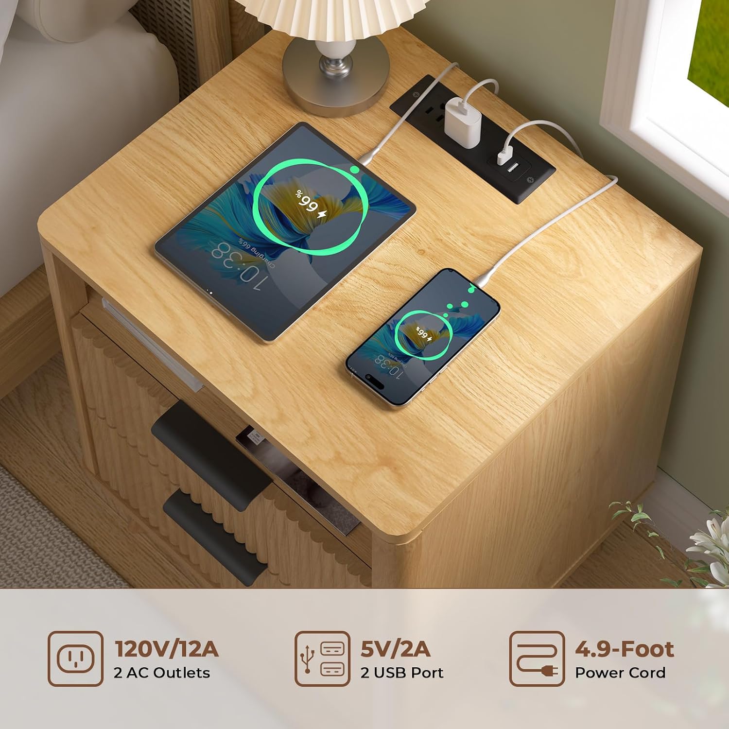 Close-up of the charging station on the nightstand with devices plugged in