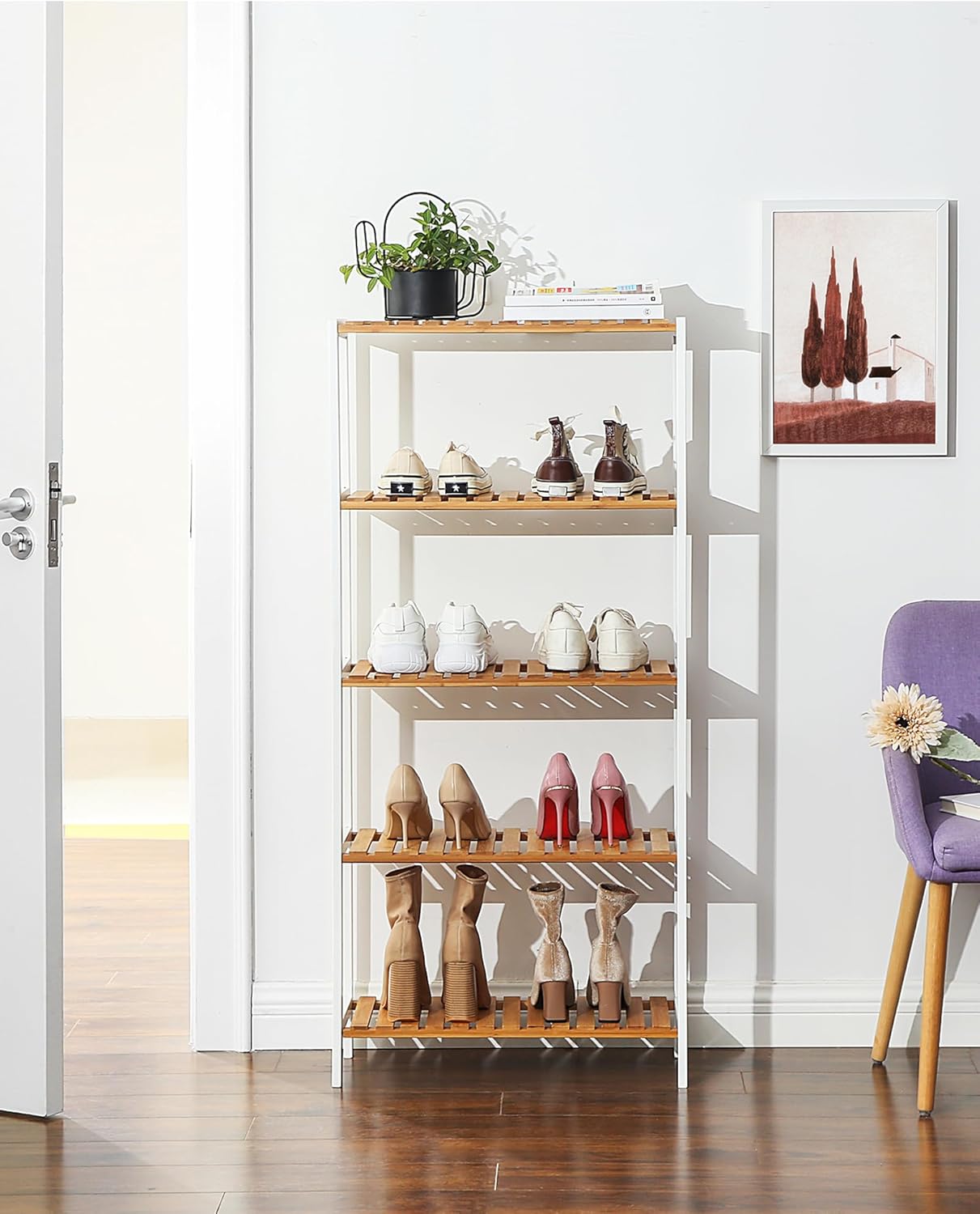SONGMICS 5-Tier Bamboo Storage Shelf used in an entryway to organize shoes and a plant.