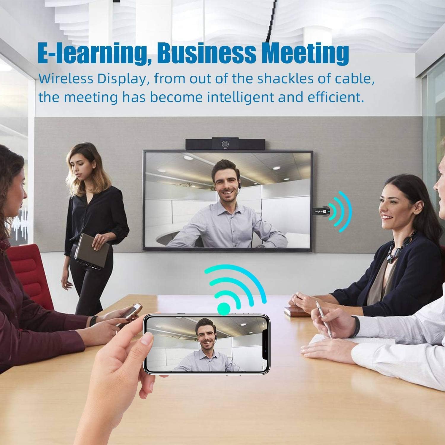 People in a business meeting setting, with a large screen displaying a video call mirrored from a smartphone, illustrating the use of the Anycast adapter for e-learning and business meetings.