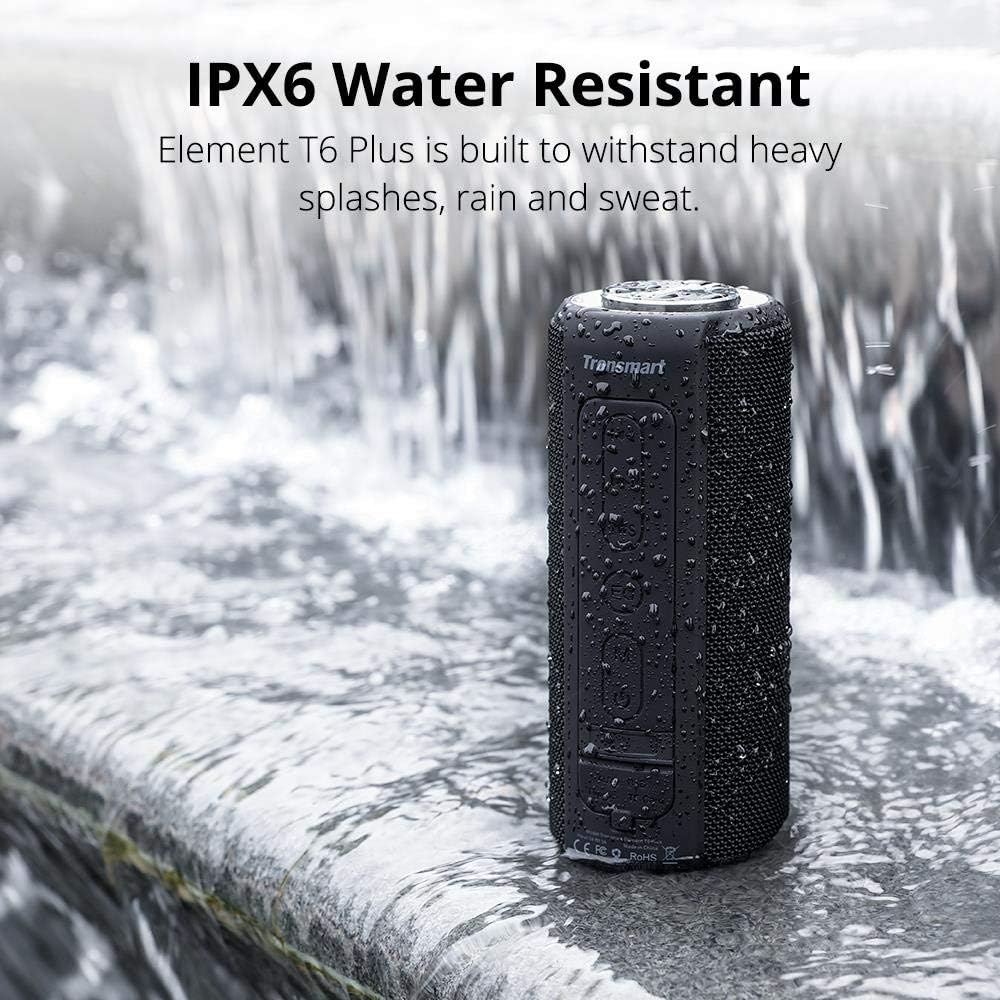 Tronsmart Element T6 Plus speaker standing in a shallow stream of water, demonstrating its IPX6 water resistance.