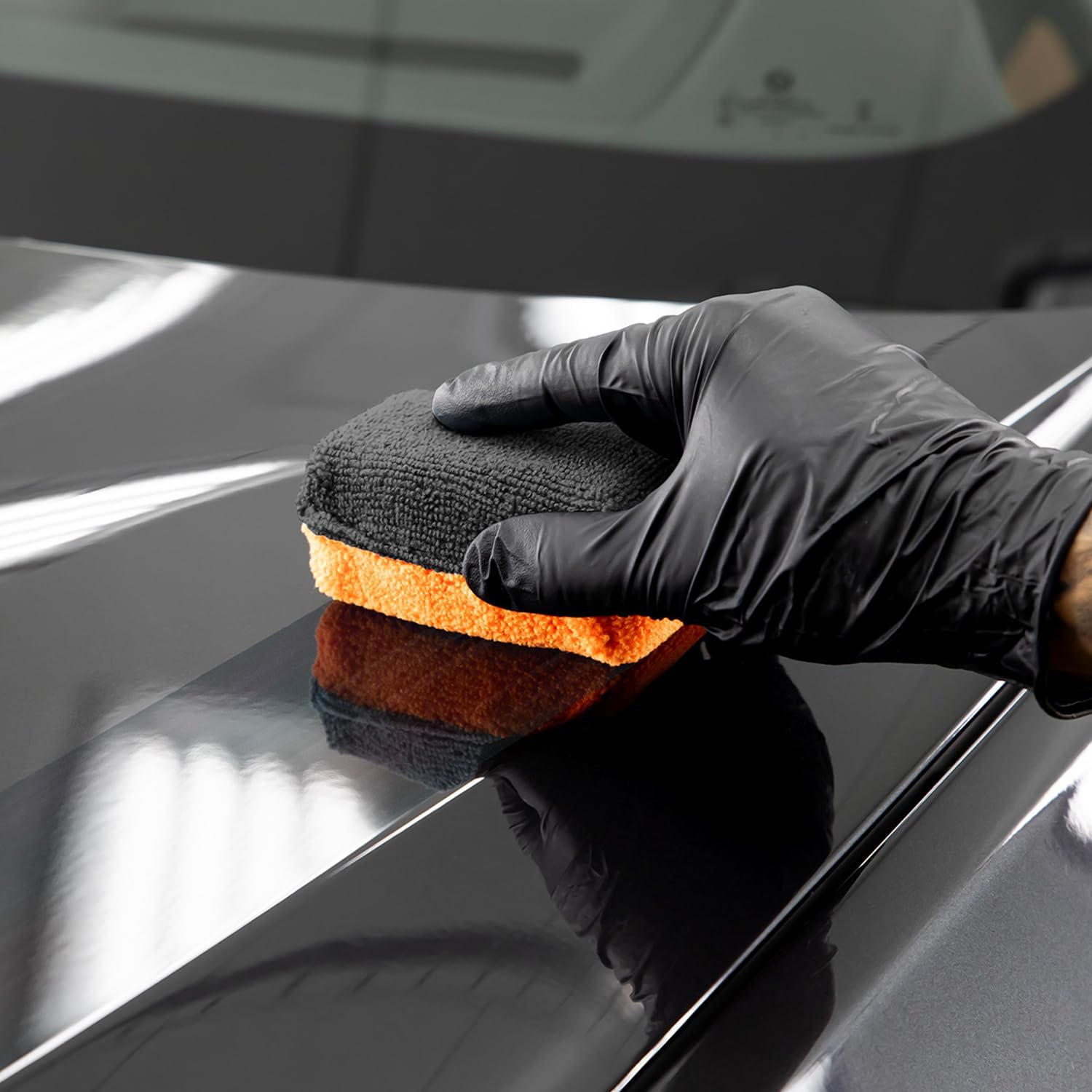 Applying Cerakote coating to a car's paint surface