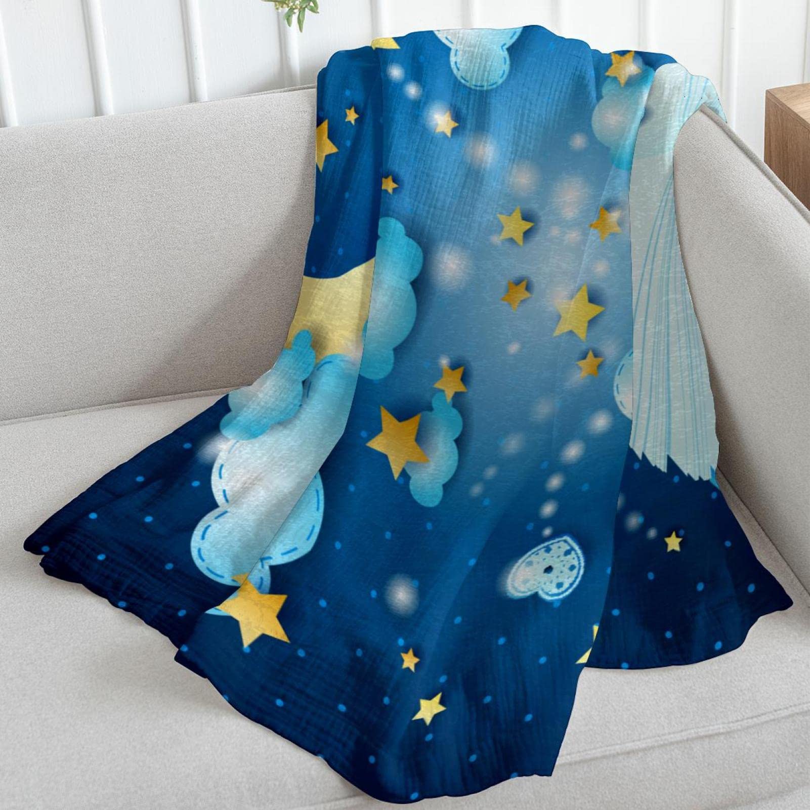 Manta de forro polar con diseño de estrellas y luna, color azul