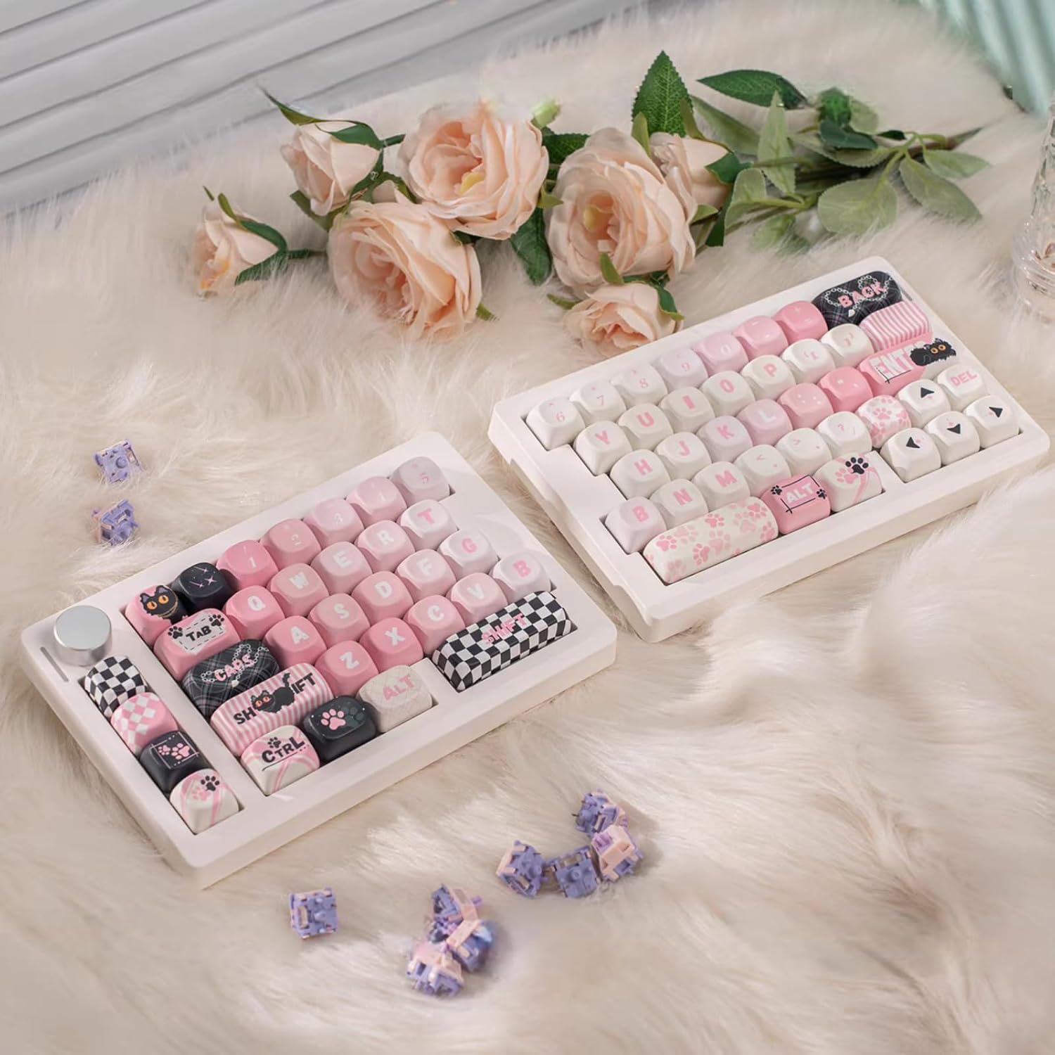 Close-up of a mechanical switch being removed from the GMK70 keyboard