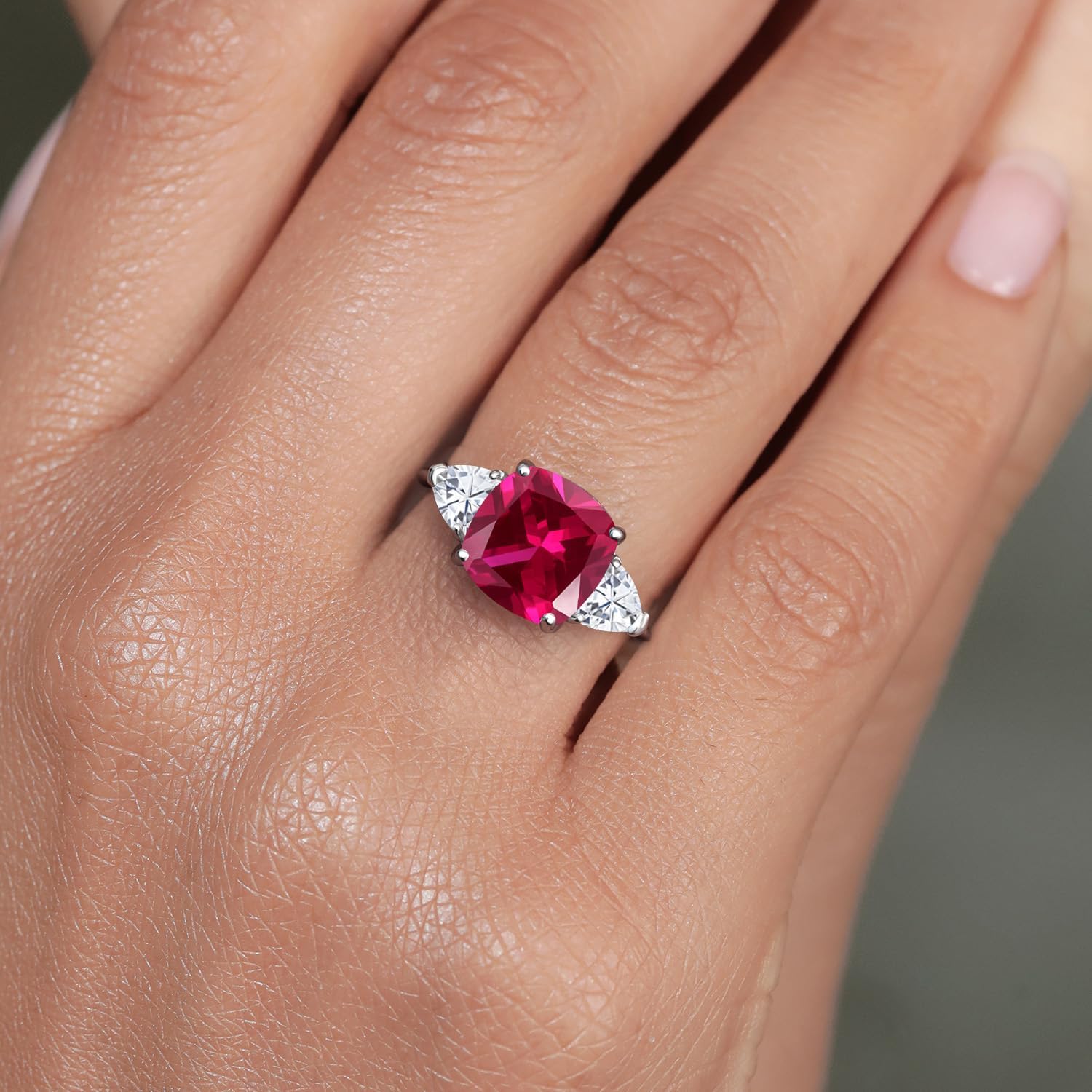 Gem Stone King 10K White Gold Red Created Ruby & White Moissanite 3-Stone Engagement Ring | 5.94 Cttw | Cushion 10MM | Trillion 5MM | 3 Stone Wedding Anniversary Promise Ring For Women