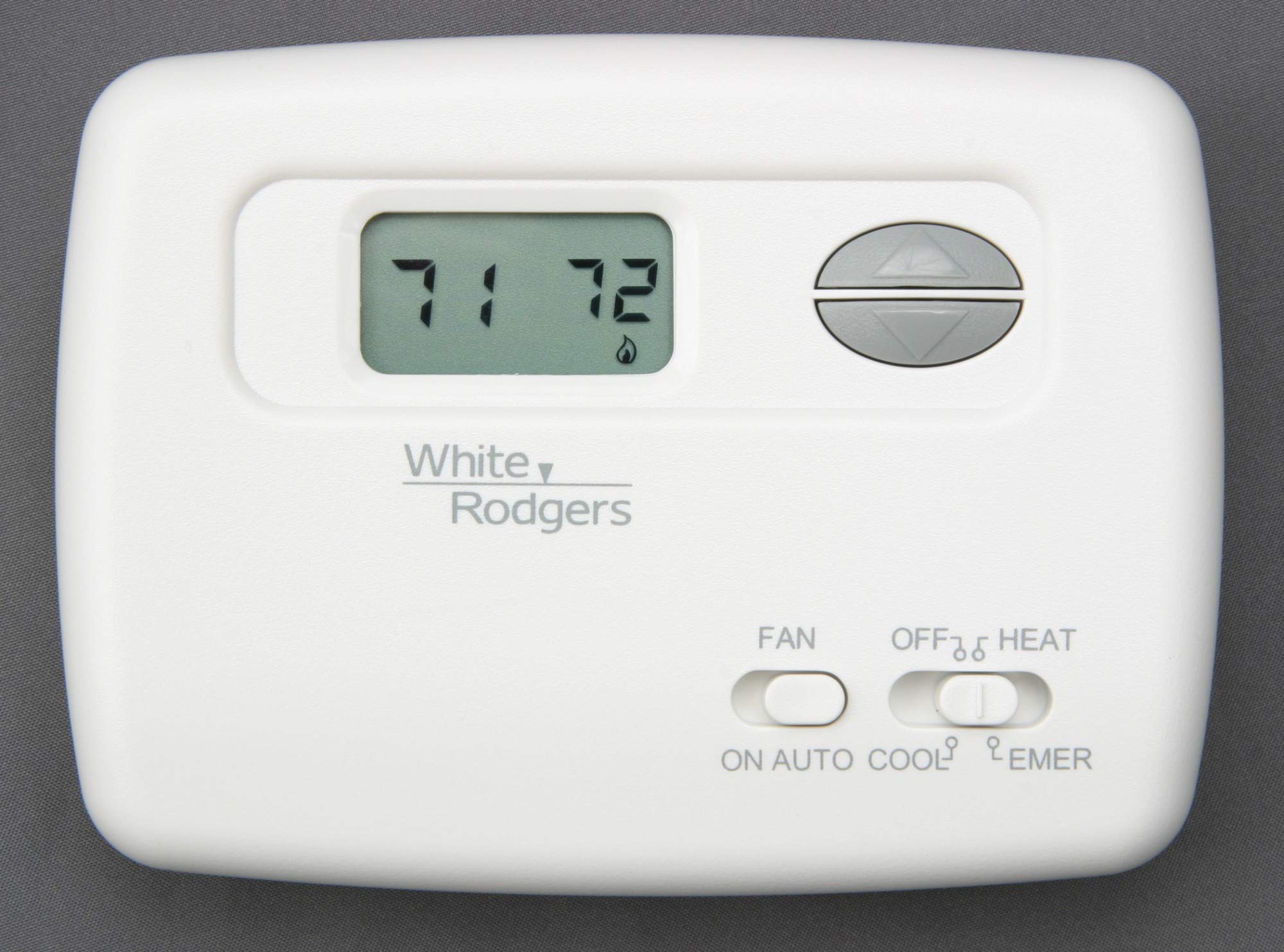 White-Rodgers 1F79-111 Digital Non-Programmable Heat Pump Thermostat with lighted display and control buttons.