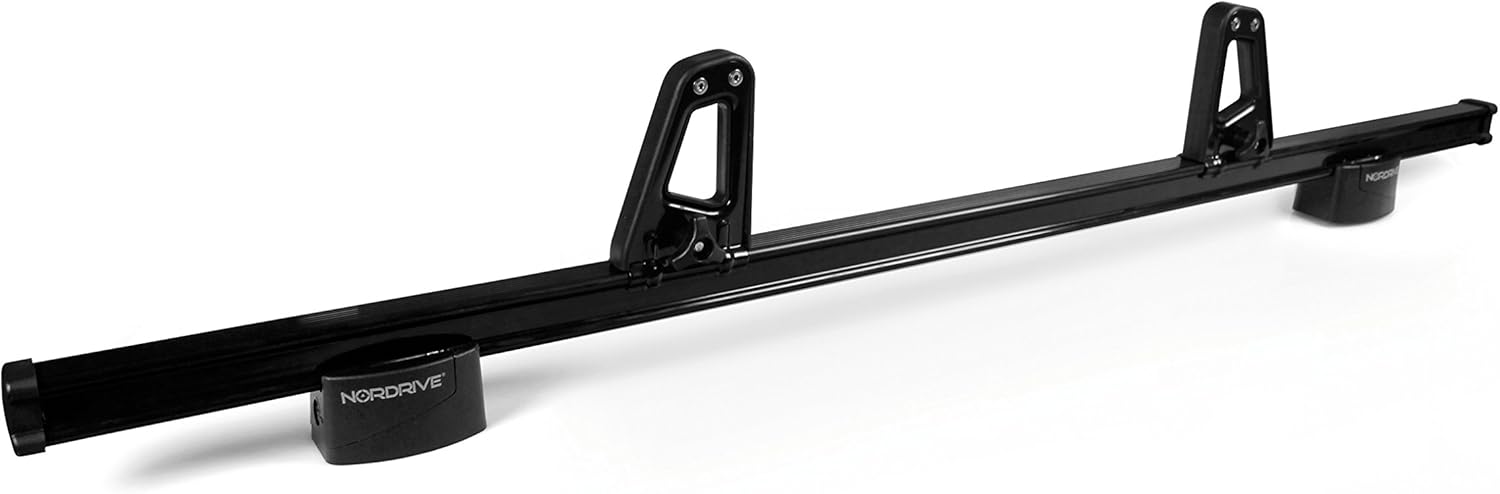 നിറഞ്ഞു view of a roof bar system with two NORDRIVE N11001 load stops installed, showing the NORDRIVE branding on the roof bar end caps.