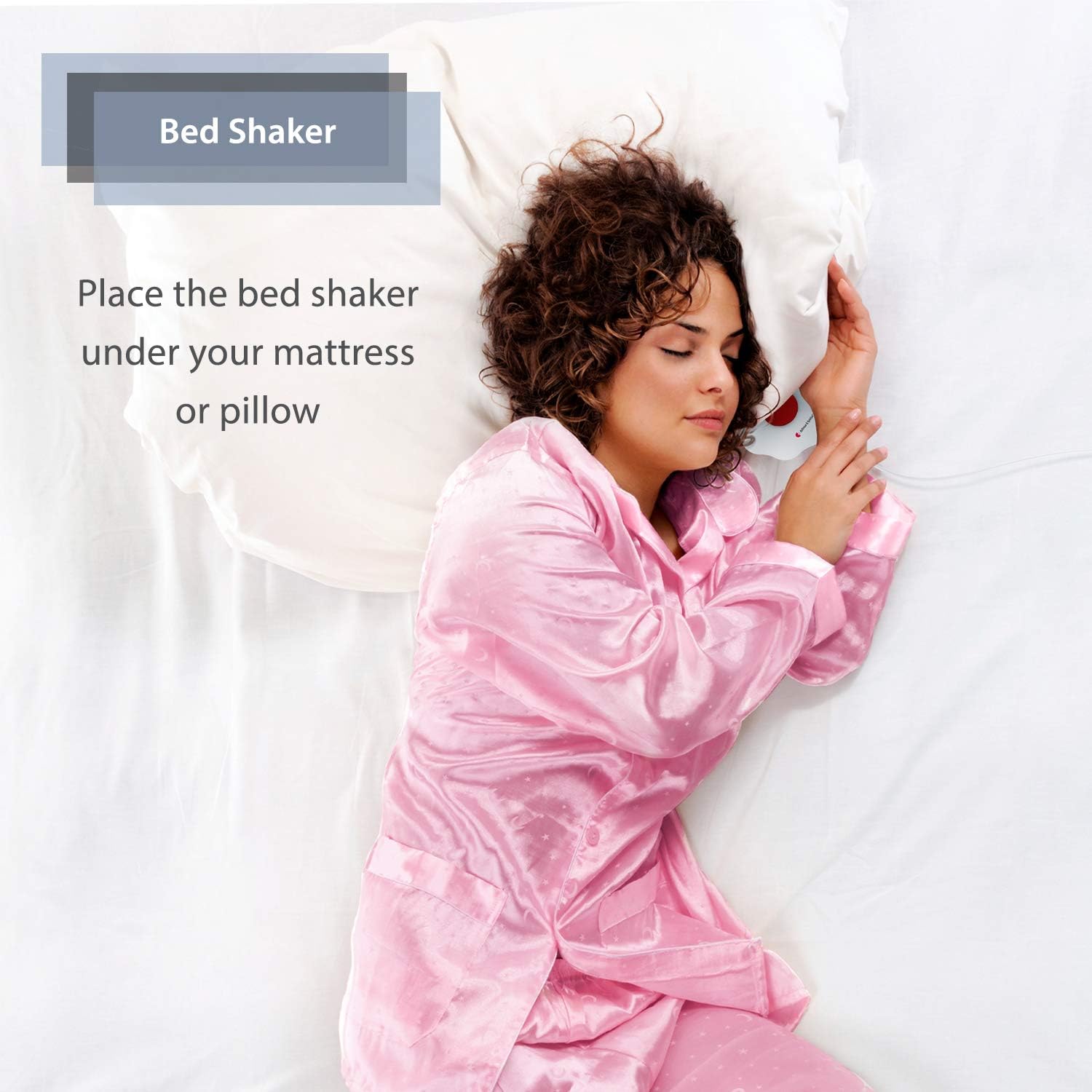 Woman sleeping with a bed shaker placed under her pillow