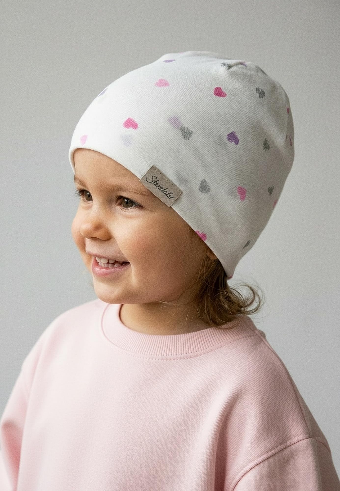 Sterntaler Beanie Herzchen – Beanie aus weichem Jersey mit glitzernden Herzchen, Zwei Tragevarianten, anschmiegsam und bequem