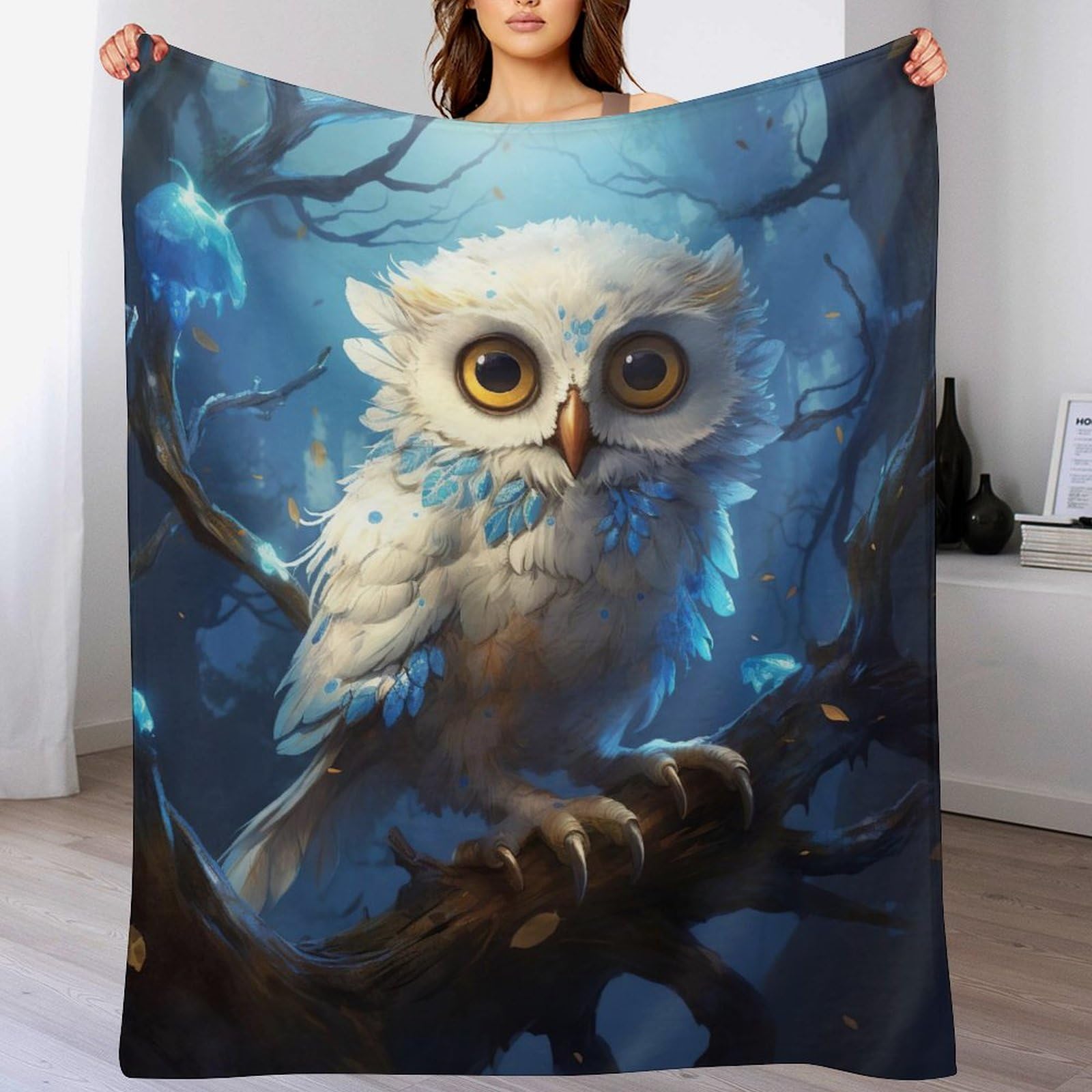 Couverture hibou polaire contre le froid sur votre canapé de séjour