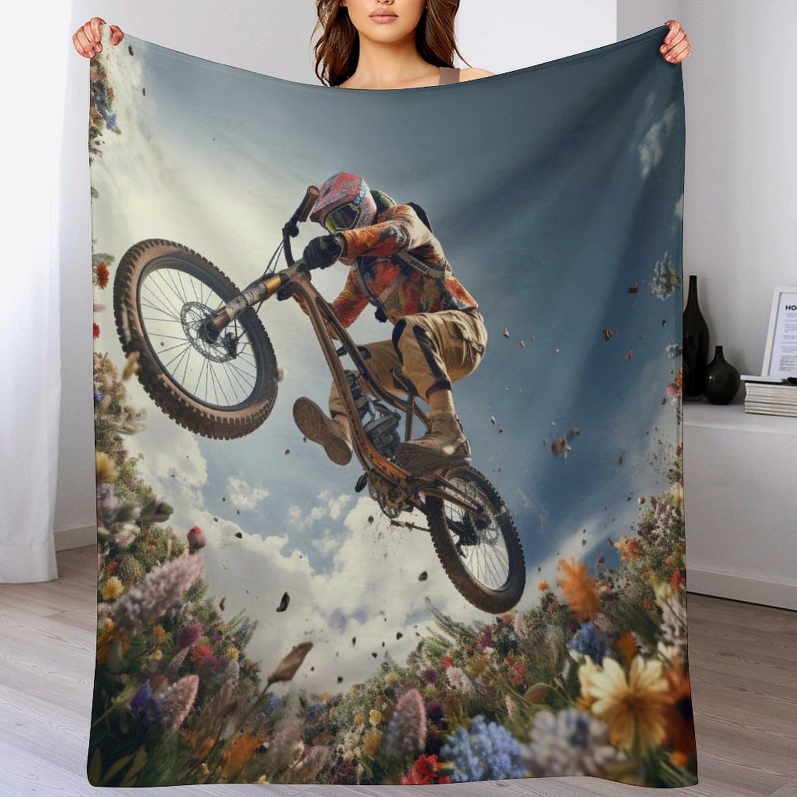 Manta para bicicleta de montaña que elimina el frío en el sofá con su franela suave