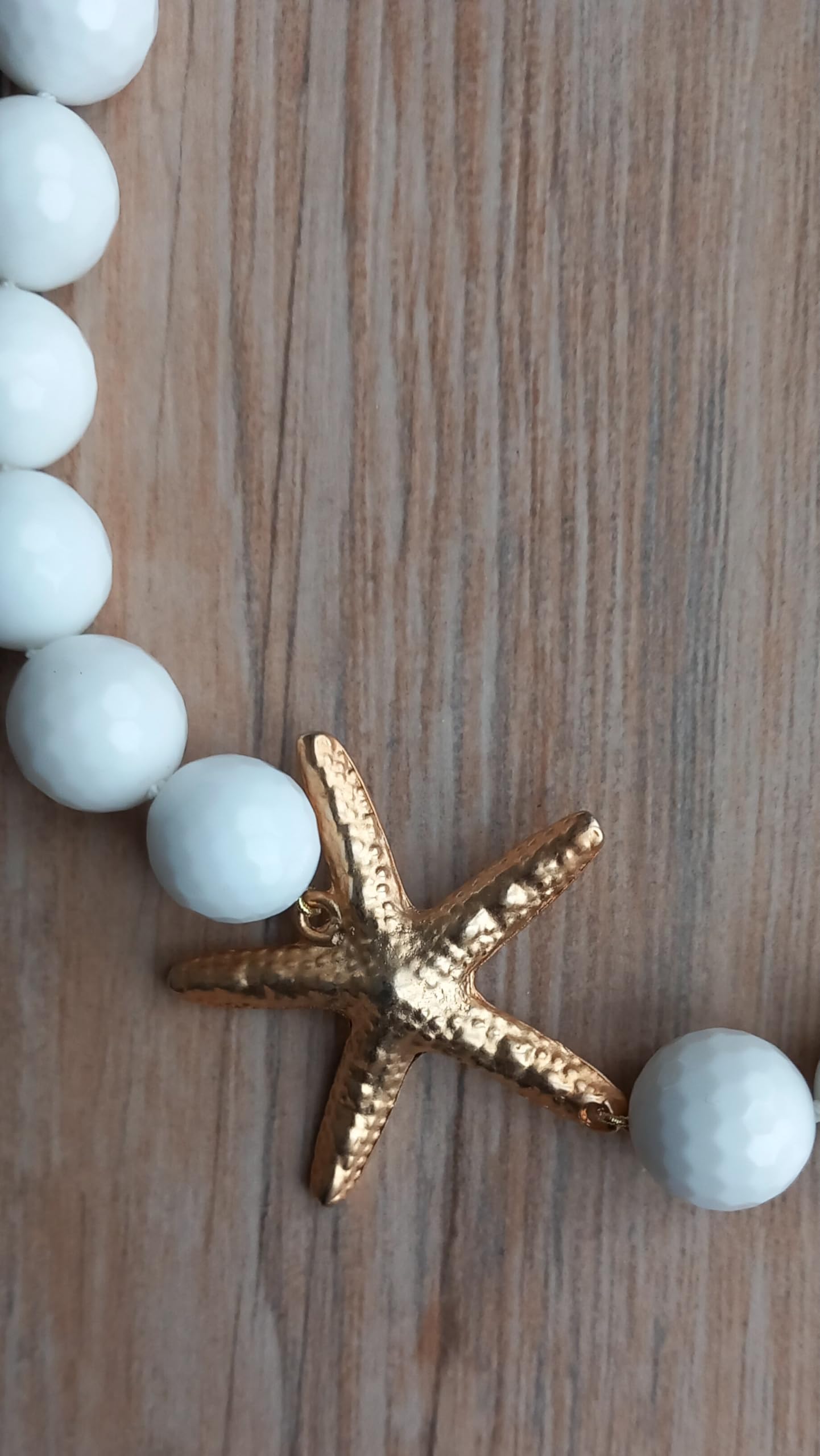 Collana girocollo fatta a mano con onice sfaccettate e stella marina