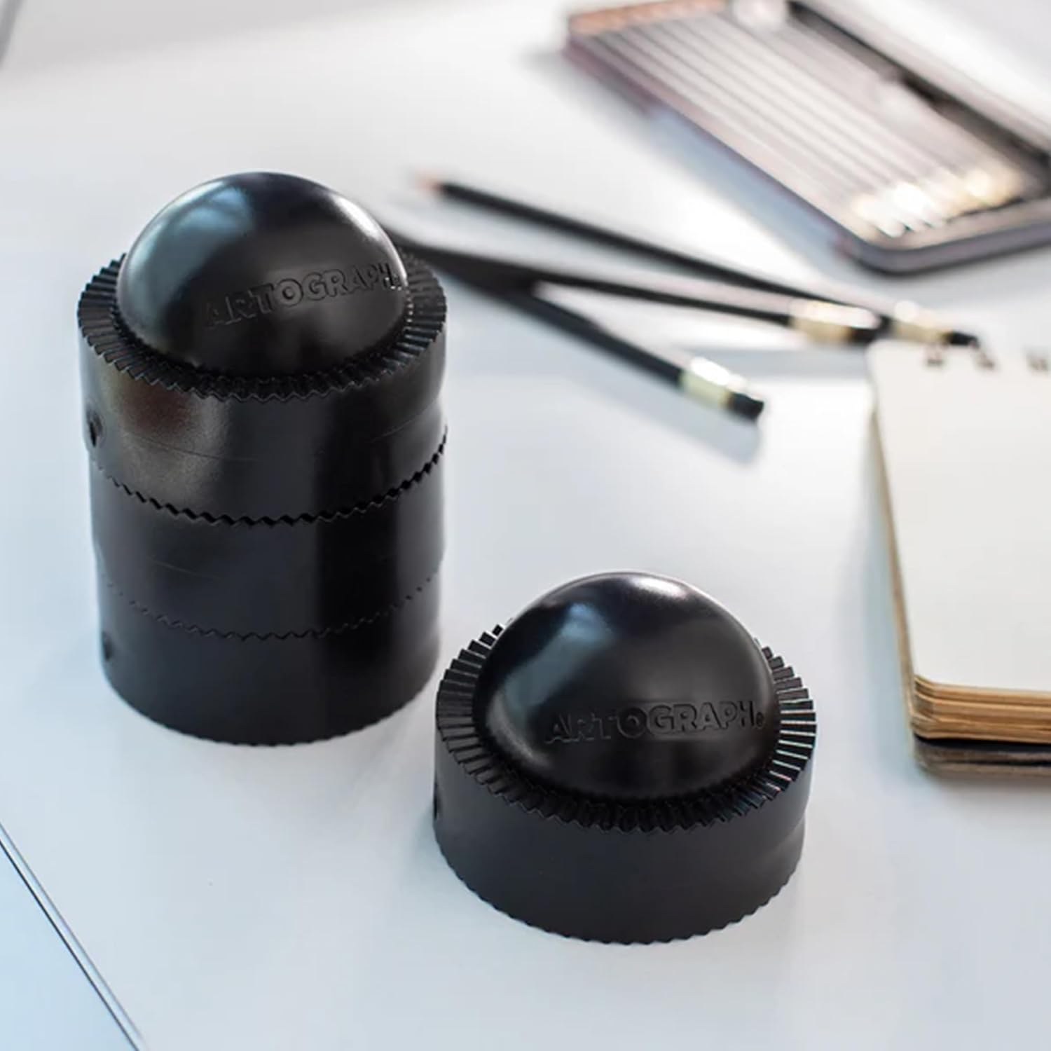 Artograph Pack of 4 PadPucks, Stackable Rubber Stands for LightPad, Tablet, or Drawing Board, Desk Riser for Tilting, Includes Mesh Storage Bag